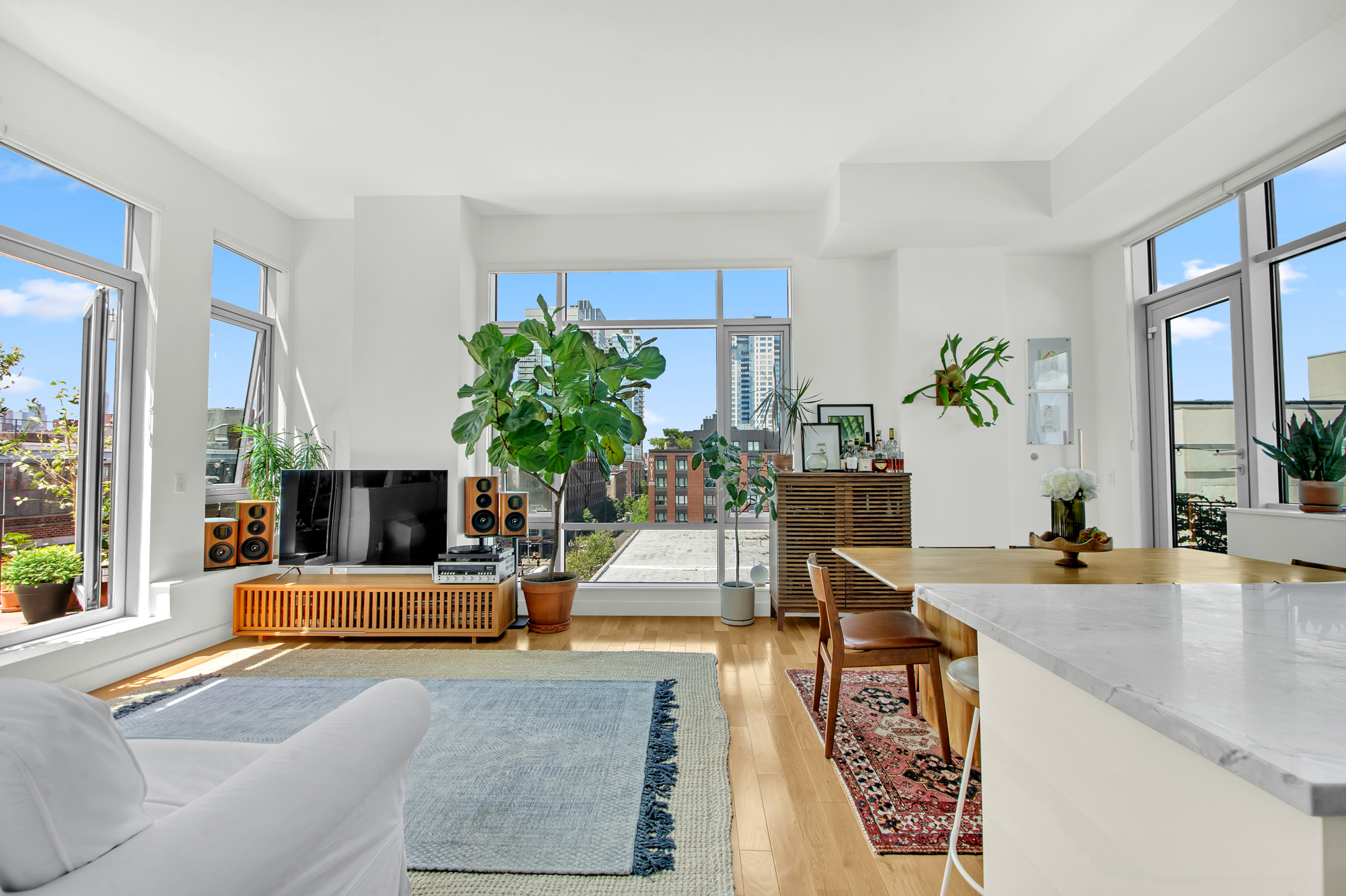 101 North 5th Street, Unit 5A Brooklyn, NY 11249 - Photo 4 of 26 a living room with furniture and a large window