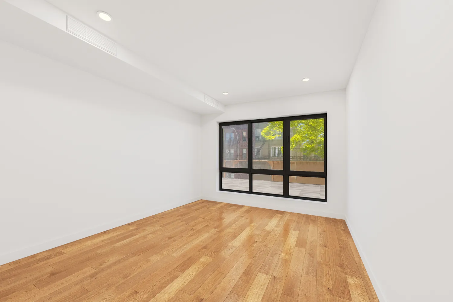 an empty room with large window