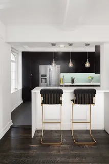 a bedroom with a bed window and a television