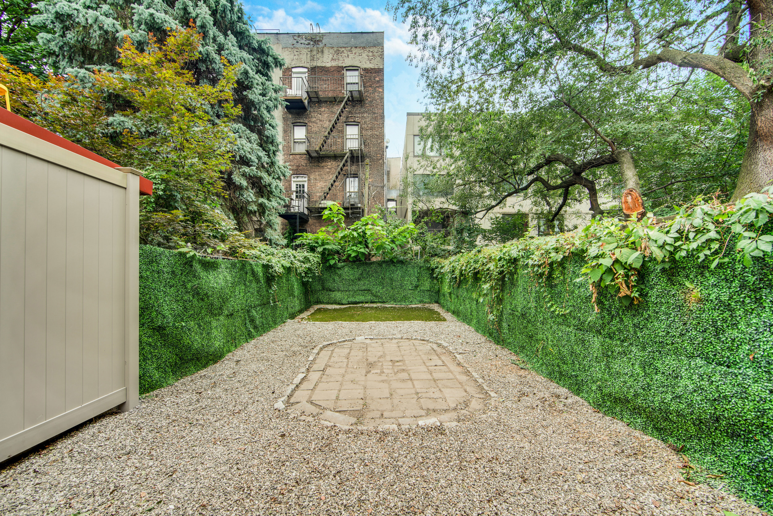 42 Monroe Street Brooklyn, NY 11238 - Photo 8 of 21 a view of backyard with plants and trees