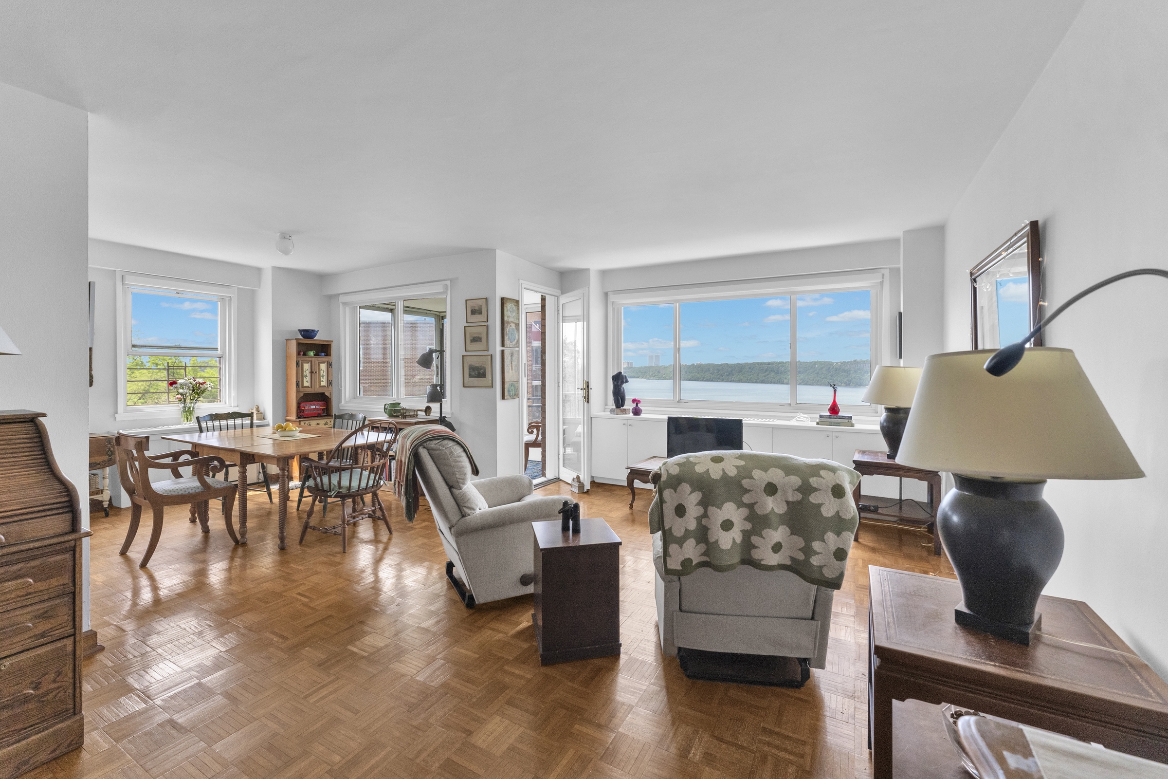 2621 Palisade Avenue, Unit 11J Bronx, NY 10463 - Photo 8 of 19 a living room with furniture and a large window