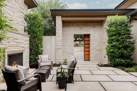 a view of backyard of house with outdoor seating