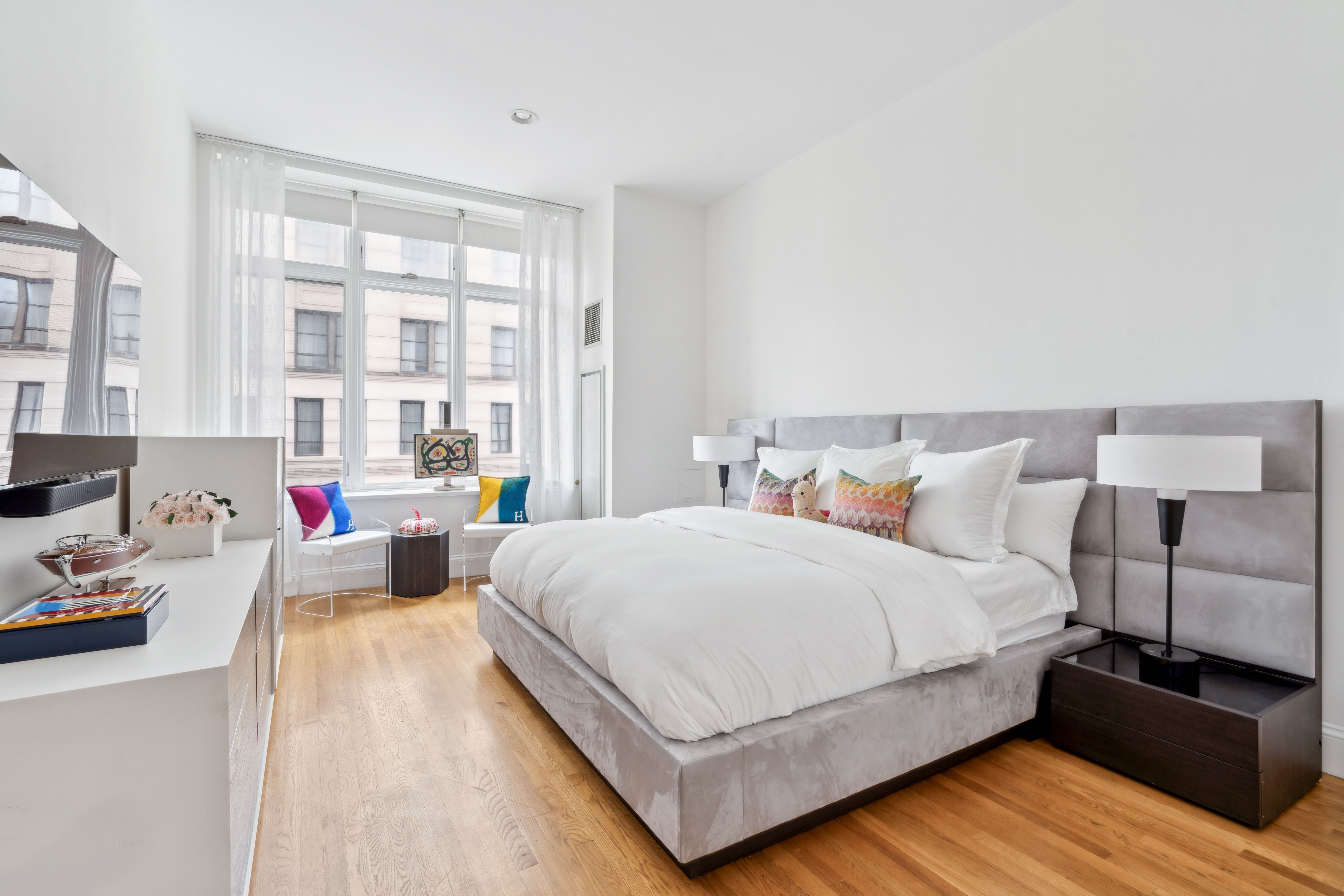 129 Lafayette Street, Unit 3B Manhattan, NY 10013 - Photo 8 of 13 a bedroom with bed and a large window