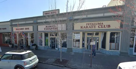 a view of a building with car parked