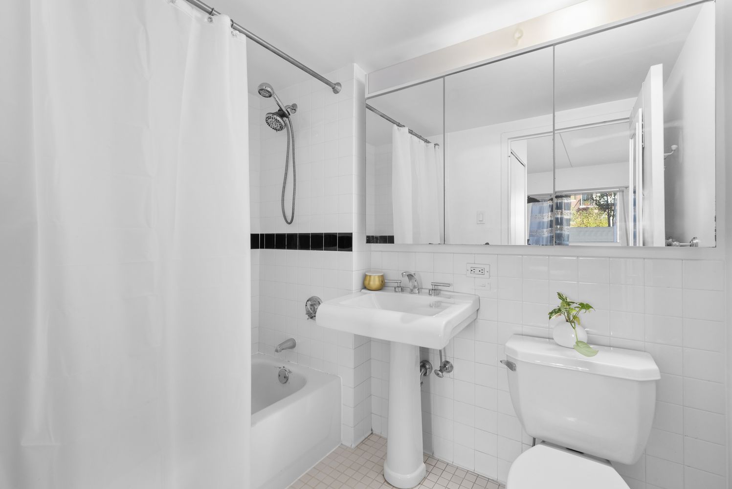 300 West 145th Street, Unit 1QQ Manhattan, NY 10039 - Photo 7 of 15 a bathroom with a sink a toilet and shower