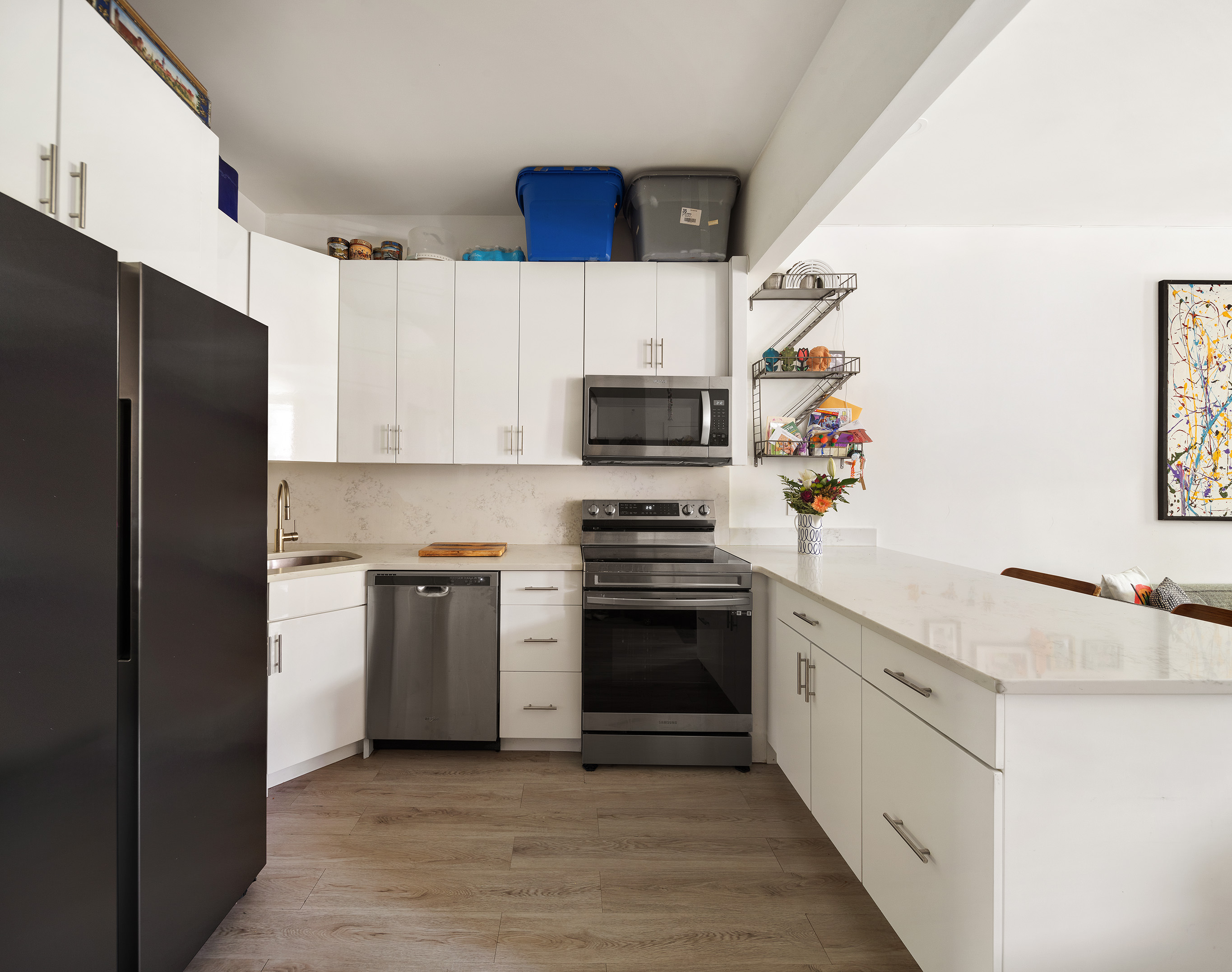 356 7th Avenue, Unit 2 Brooklyn, NY 11215 - Photo 2 of 7 a kitchen with granite countertop white cabinets and stainless steel appliances