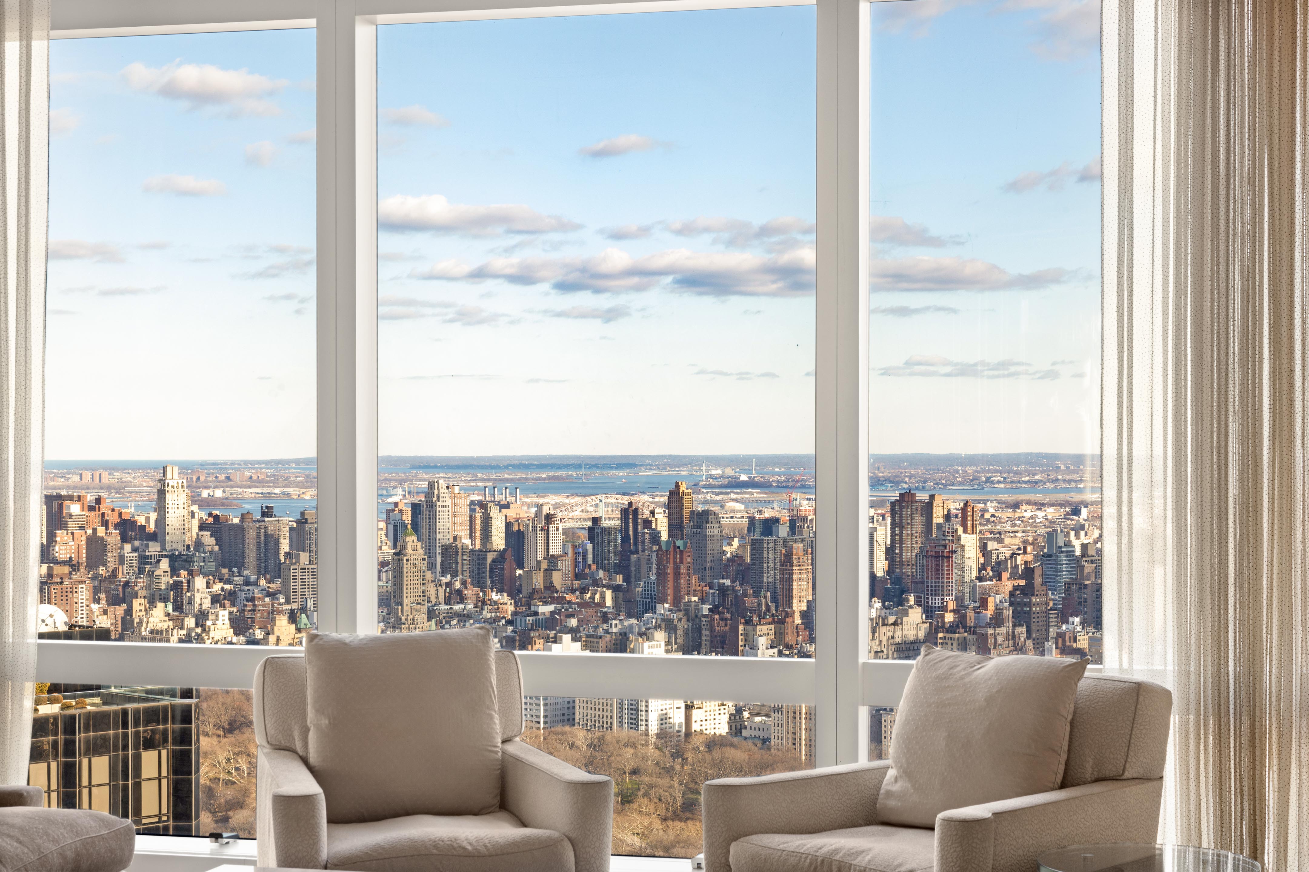 25 Columbus Circle, Unit 75A Manhattan, NY 10019 - Photo 4 of 36 a view of a city from a living room