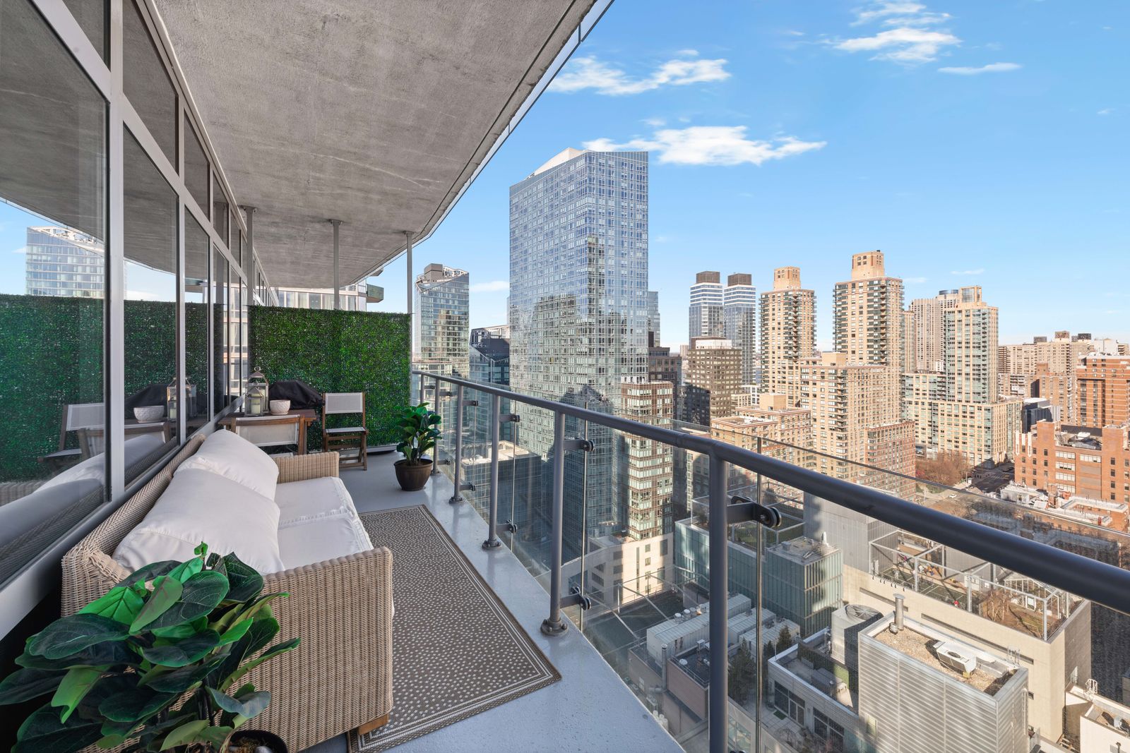 555 West 59th Street, Unit 25E Manhattan, NY 10019 - Photo 10 of 18 a view of balcony with potted plants