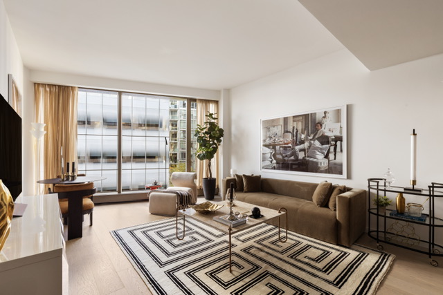 500 West 18th Street, Unit WEST 5E Manhattan, NY 10011 - Photo 1 of 15 a living room with furniture and a floor to ceiling window