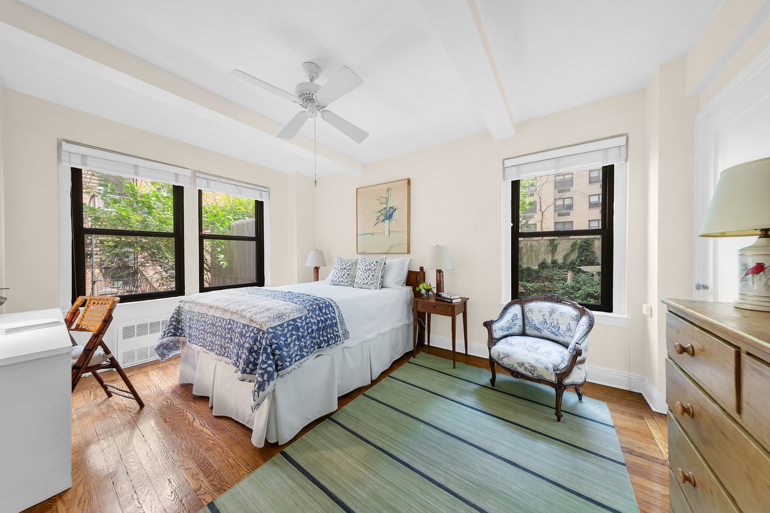 151 East 83rd Street, Unit 2E Manhattan, NY 10028 - Photo 4 of 12 a bedroom with a bed and a windows