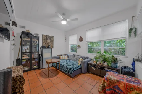 a front view of a multi story building with yard