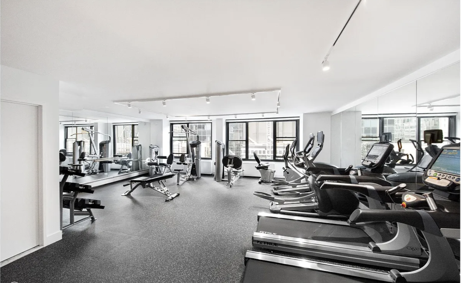 117 East 57th Street, Unit 48G Manhattan, NY 10022 - Photo 11 of 13 a view of a room with gym equipment