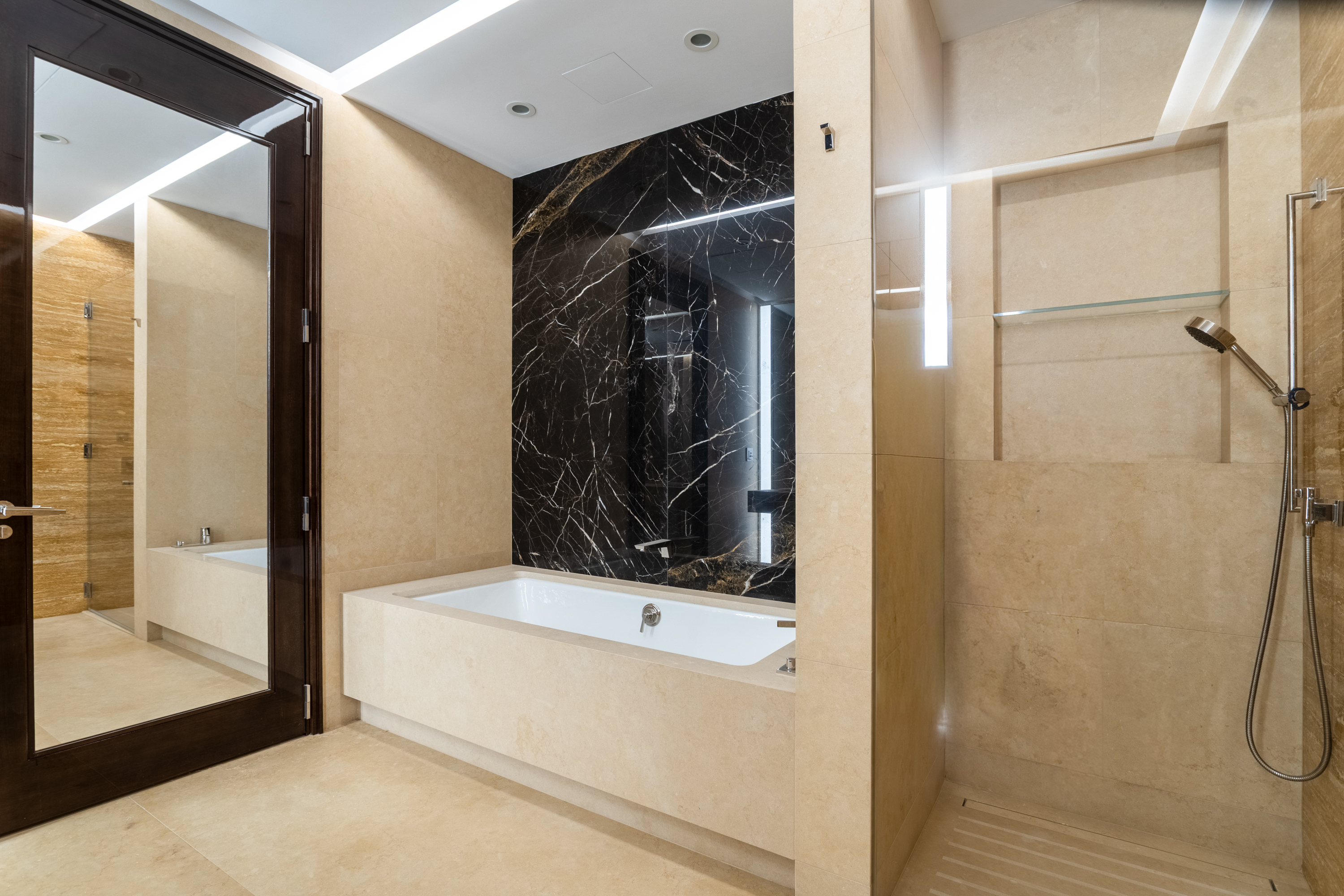 53 West 53rd Street, Unit 20E Manhattan, NY 10019 - Photo 8 of 11 a bathroom with a bathtub and a shower