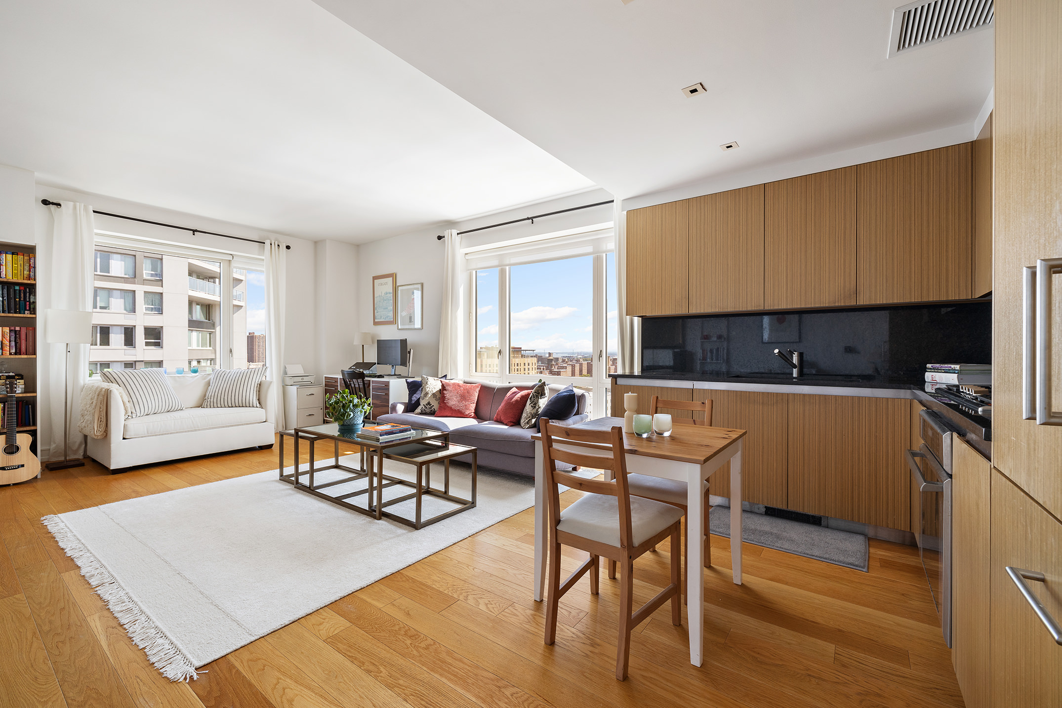 1280 5th Avenue, Unit 19E Manhattan, NY 10029 - Photo 1 of 12 a living room with furniture and a window