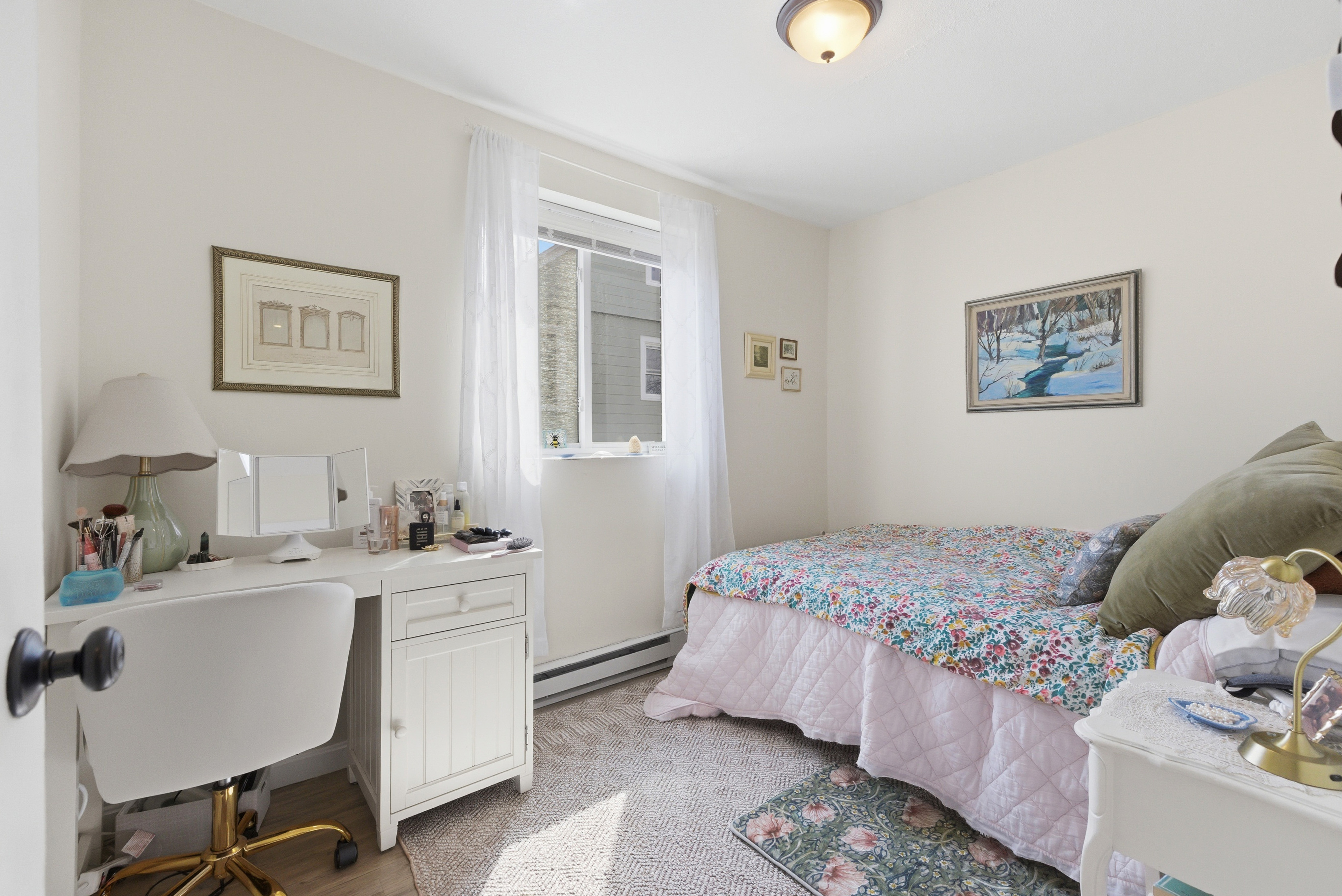 197 Calumet Street, Unit 10 Boston, MA 02120 - Photo 5 of 10 a bedroom with a bed and a chandelier
