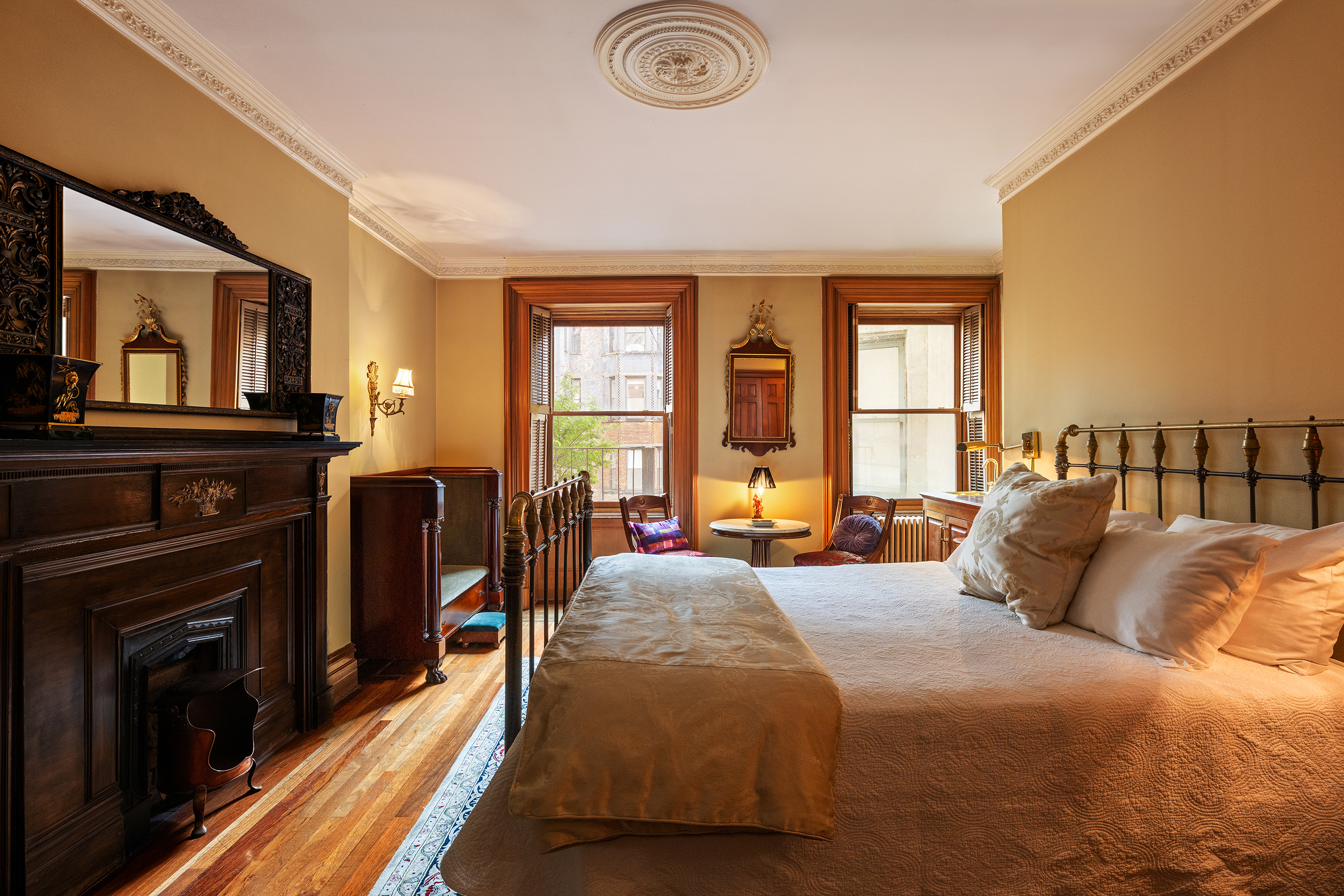 a bedroom with a bed and a television