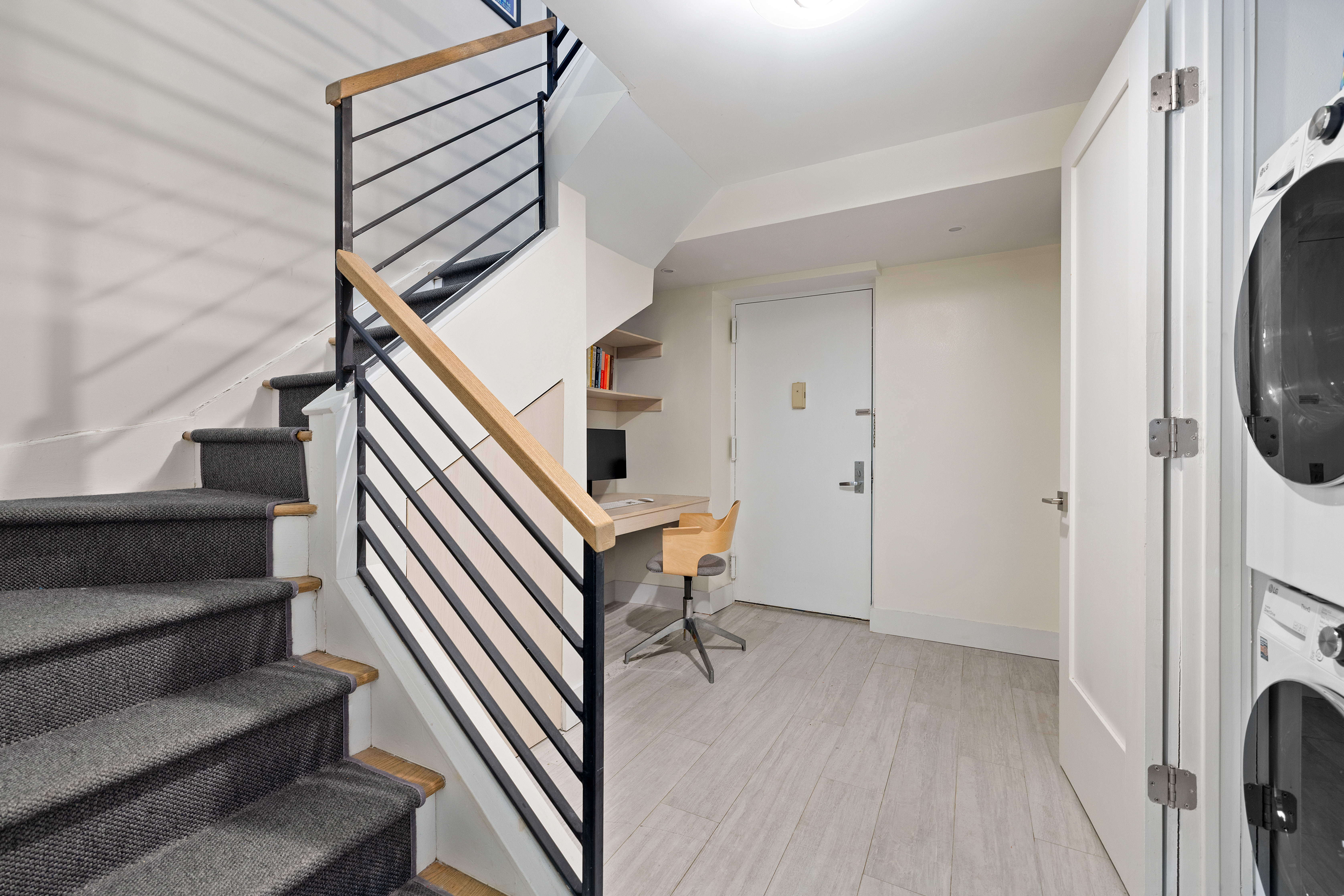 1115-1139 Prospect Avenue, Unit 1B Brooklyn, NY 11218 - Photo 5 of 9 a view of a hallway with entryway wooden floor and front door