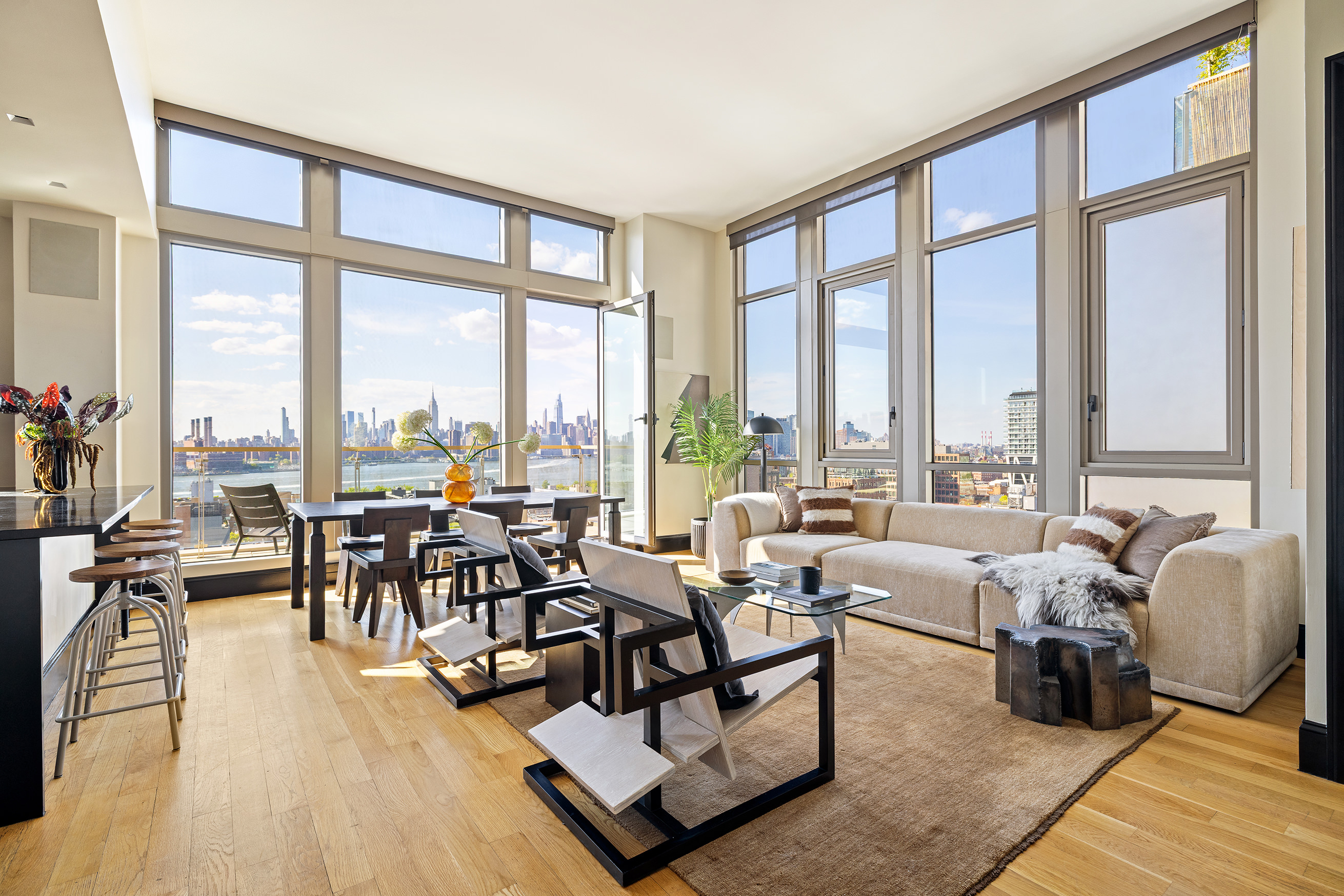 144 North 8th Street, Unit 12A Brooklyn, NY 11249 - Photo 7 of 21 a living room with furniture and floor to ceiling windows
