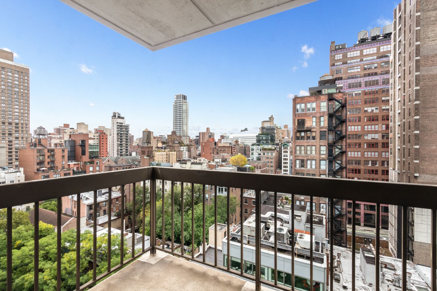 111 East 30th Street, Unit 14A Manhattan, NY 10016 - Photo 12 of 16 a view of a tall building from a balcony