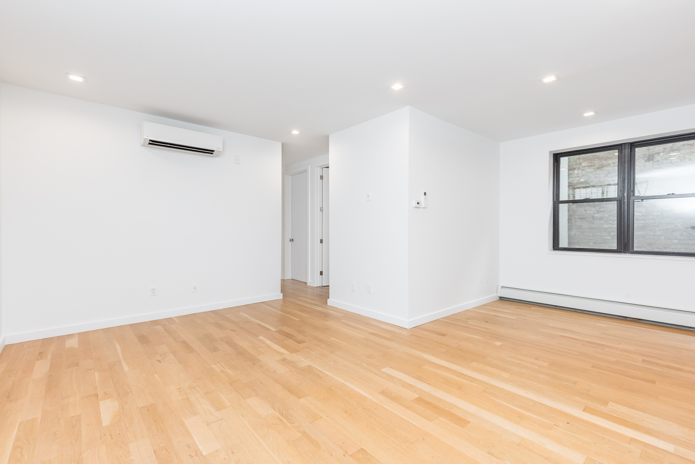 22-11 Steinway Street, Unit 3R Queens, NY 11105 - Photo 7 of 9 a view of an empty room