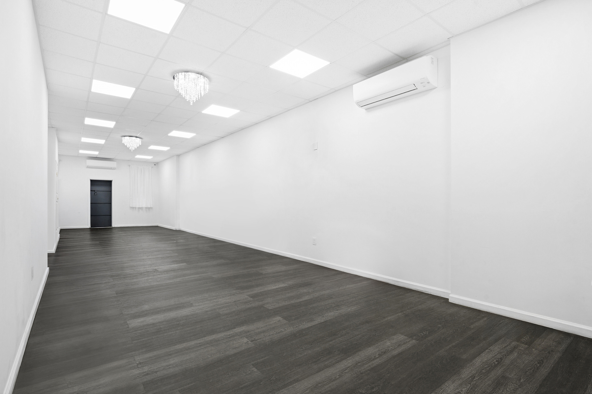 1541 Nostrand Avenue Brooklyn, NY 11226 - Photo 11 of 16 a view of a room with wooden floor and a window