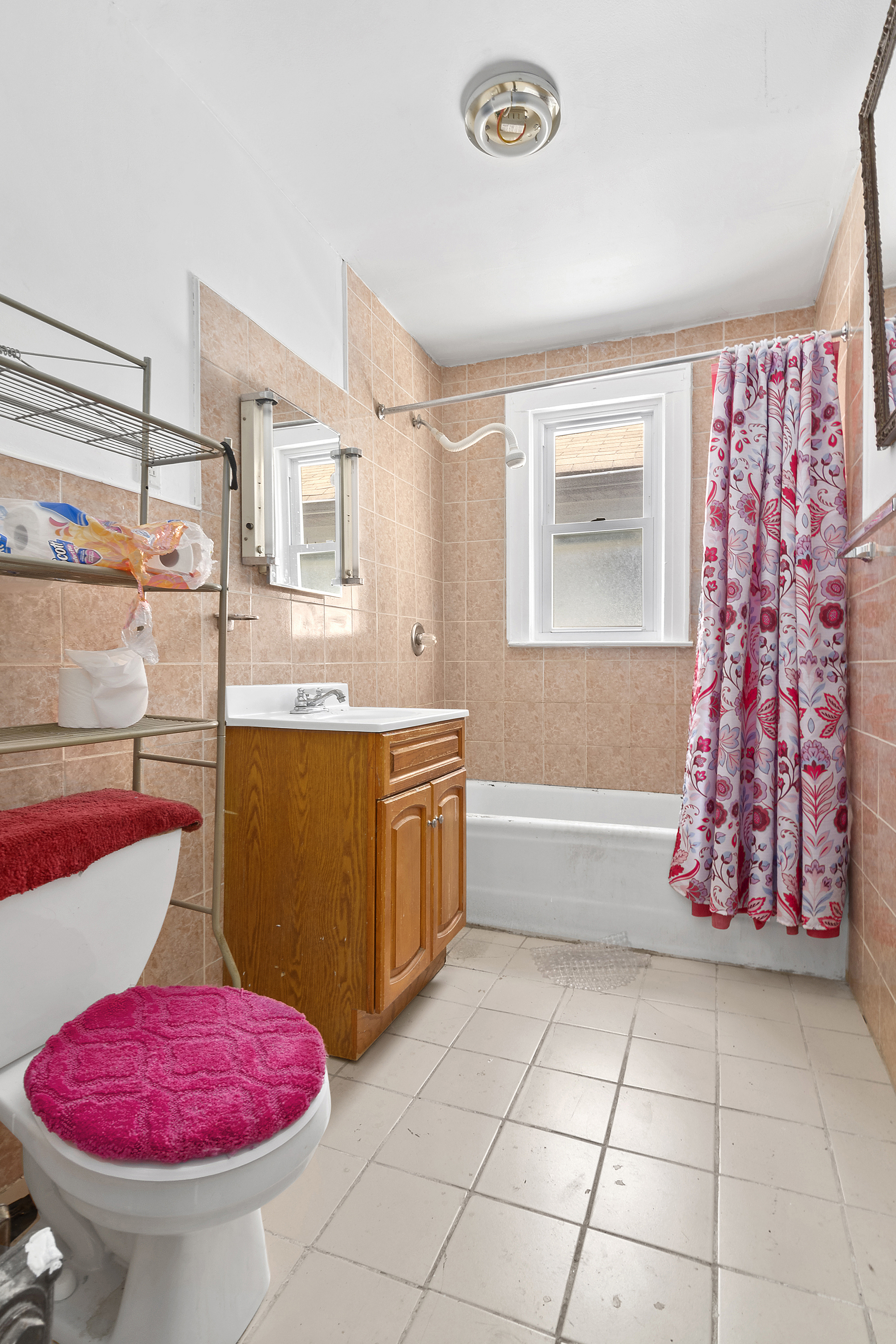 266 East 43rd Street Brooklyn, NY 11203 - Photo 6 of 11 a bathroom with a tub shower and sink