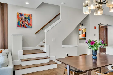 a view of dining room with furniture and wooden floor