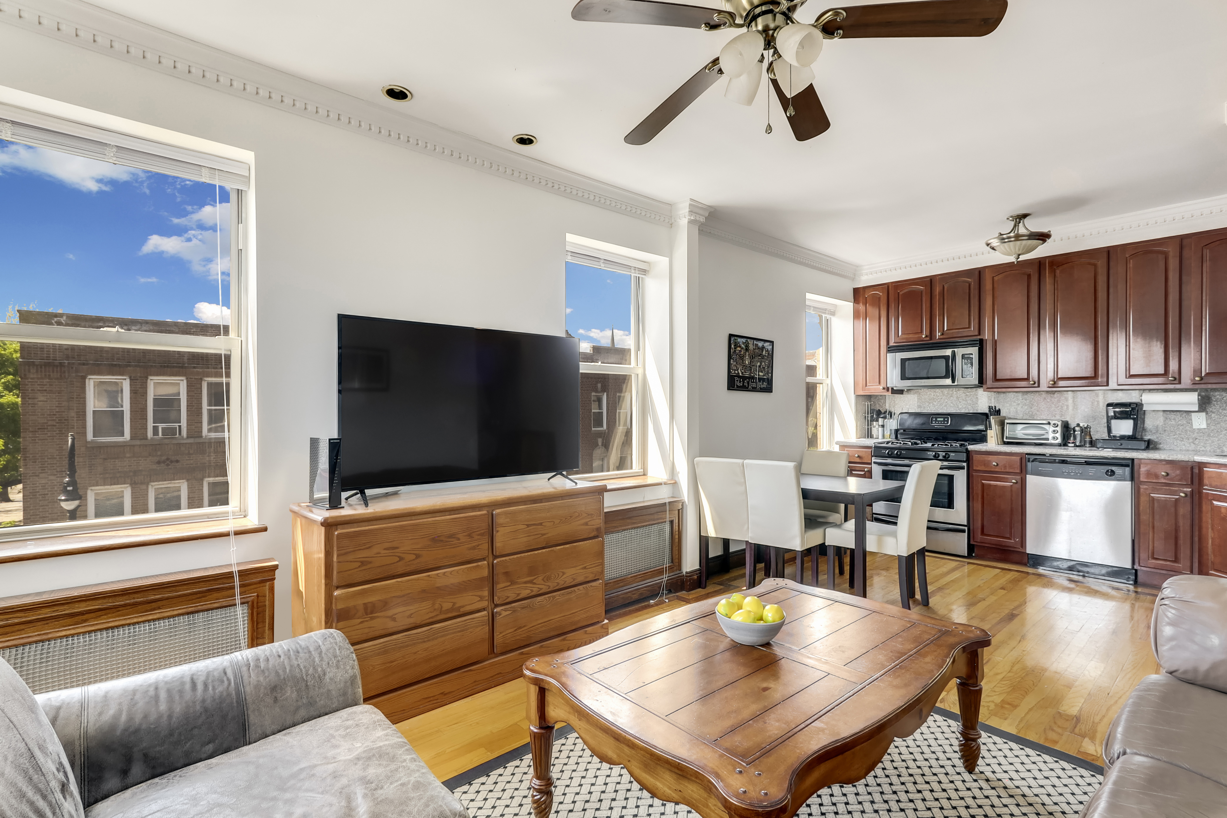 a living room with furniture and a flat screen tv