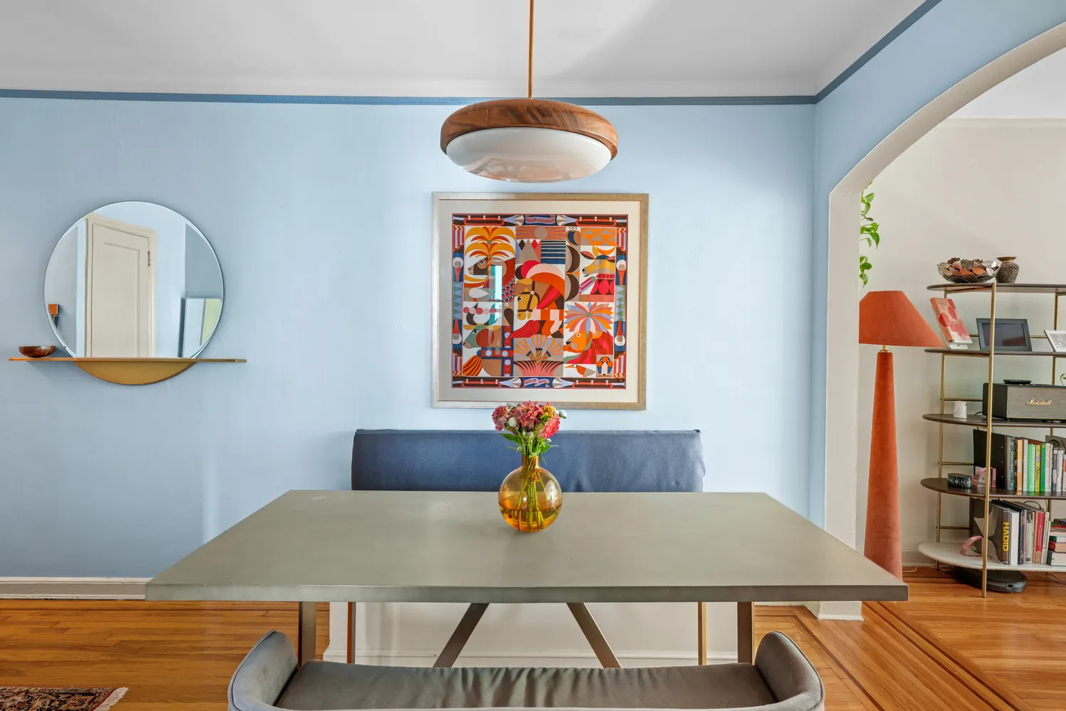 a view of a dining room with furniture and wooden floor