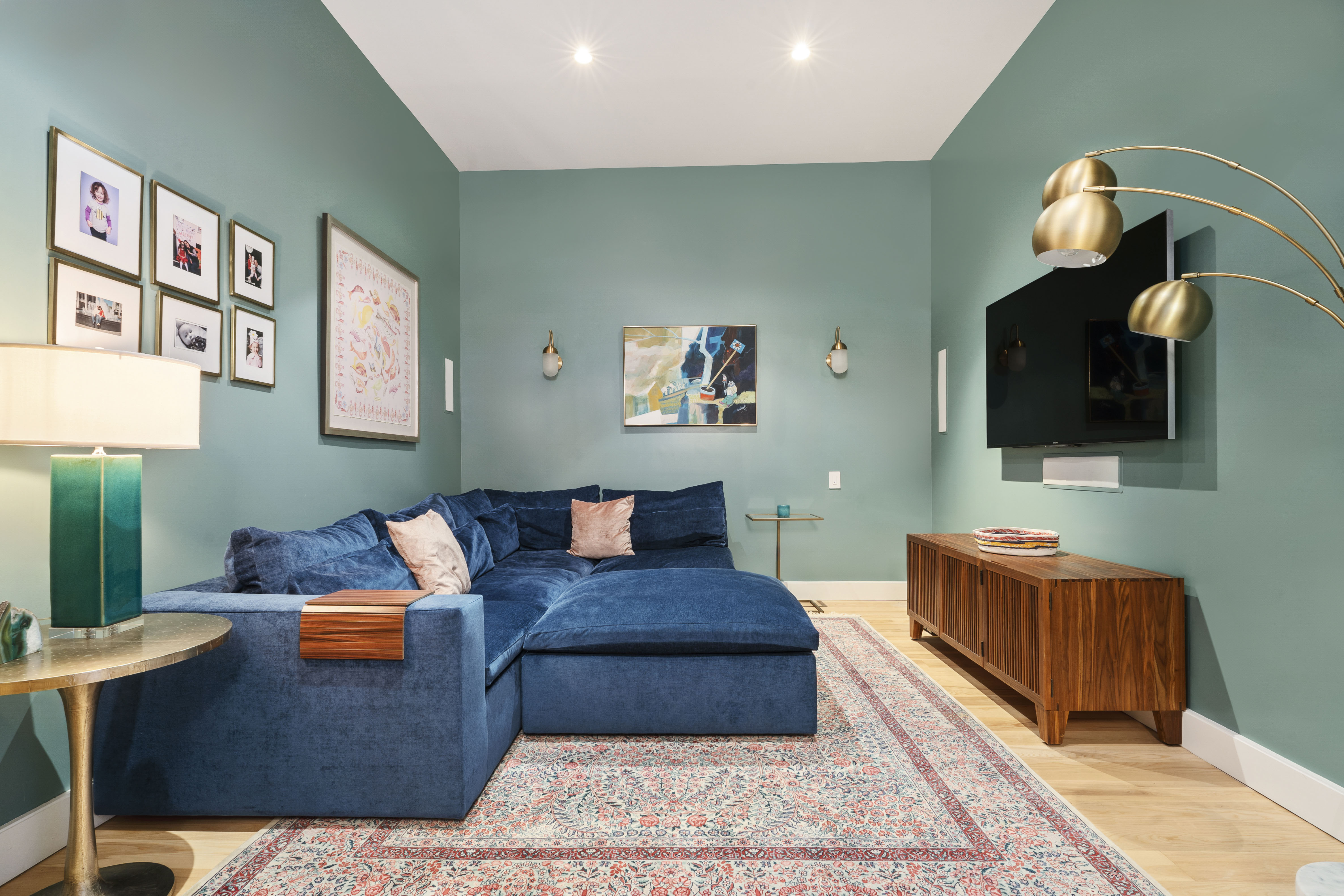 360 Furman Street, Unit 734 Brooklyn, NY 11201 - Photo 12 of 31 a living room with furniture and a flat screen tv
