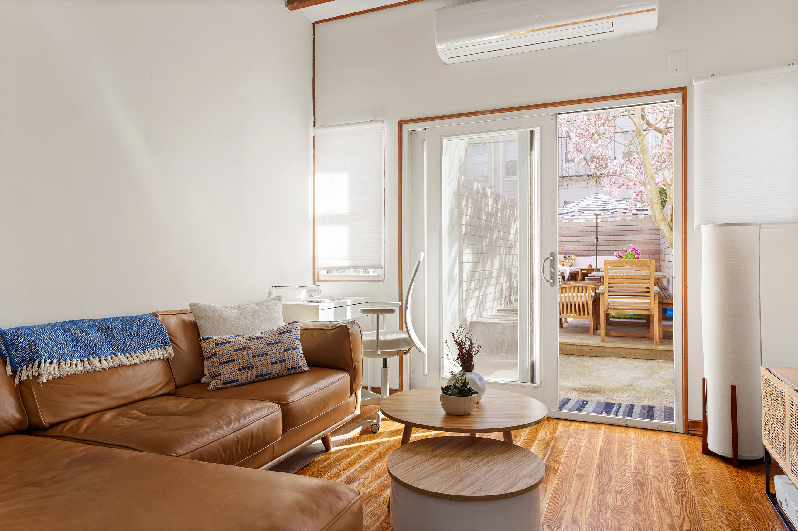 171 Monitor Street Brooklyn, NY 11222 - Photo 3 of 11 a living room with furniture and a large window