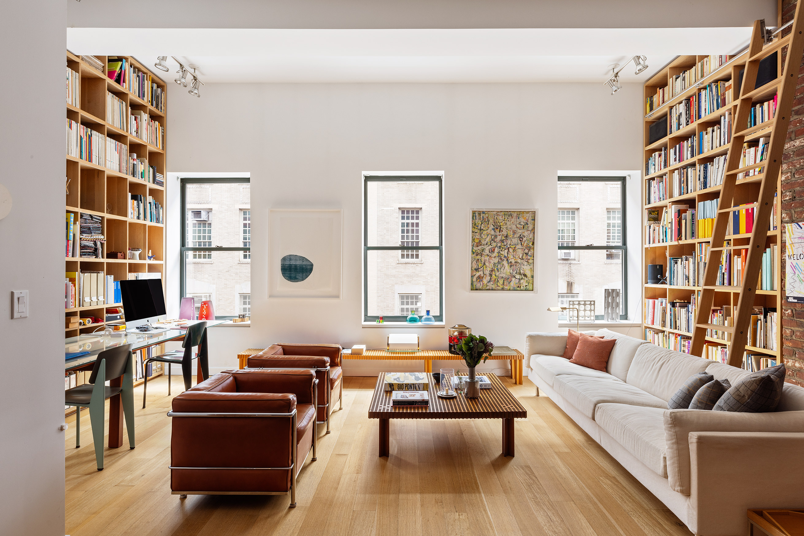 71 Ludlow Street, Unit 4B Manhattan, NY 10002 - Photo 2 of 15 a living room with furniture and a large window