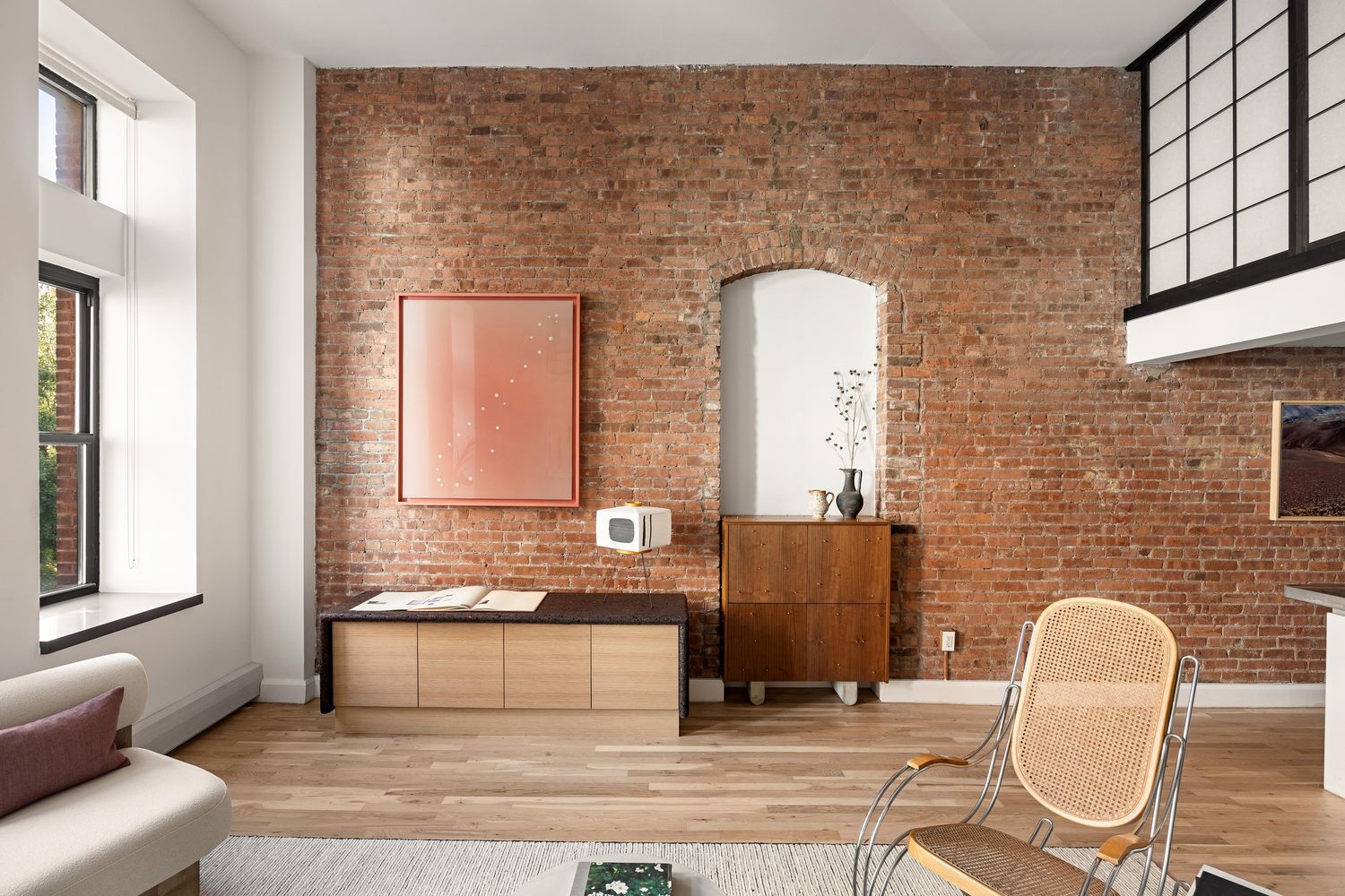 a living room with furniture and a window