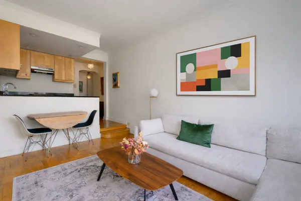 a living room with furniture and a rug