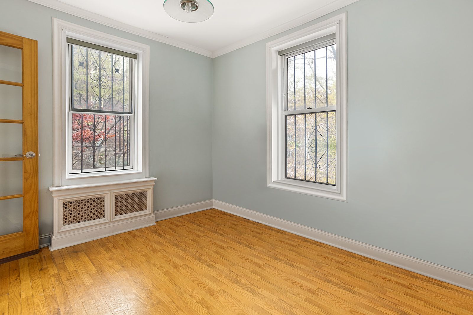 79-10 34th Avenue, Unit 2G Queens, NY 11372 - Photo 8 of 11 a view of an empty room with a window