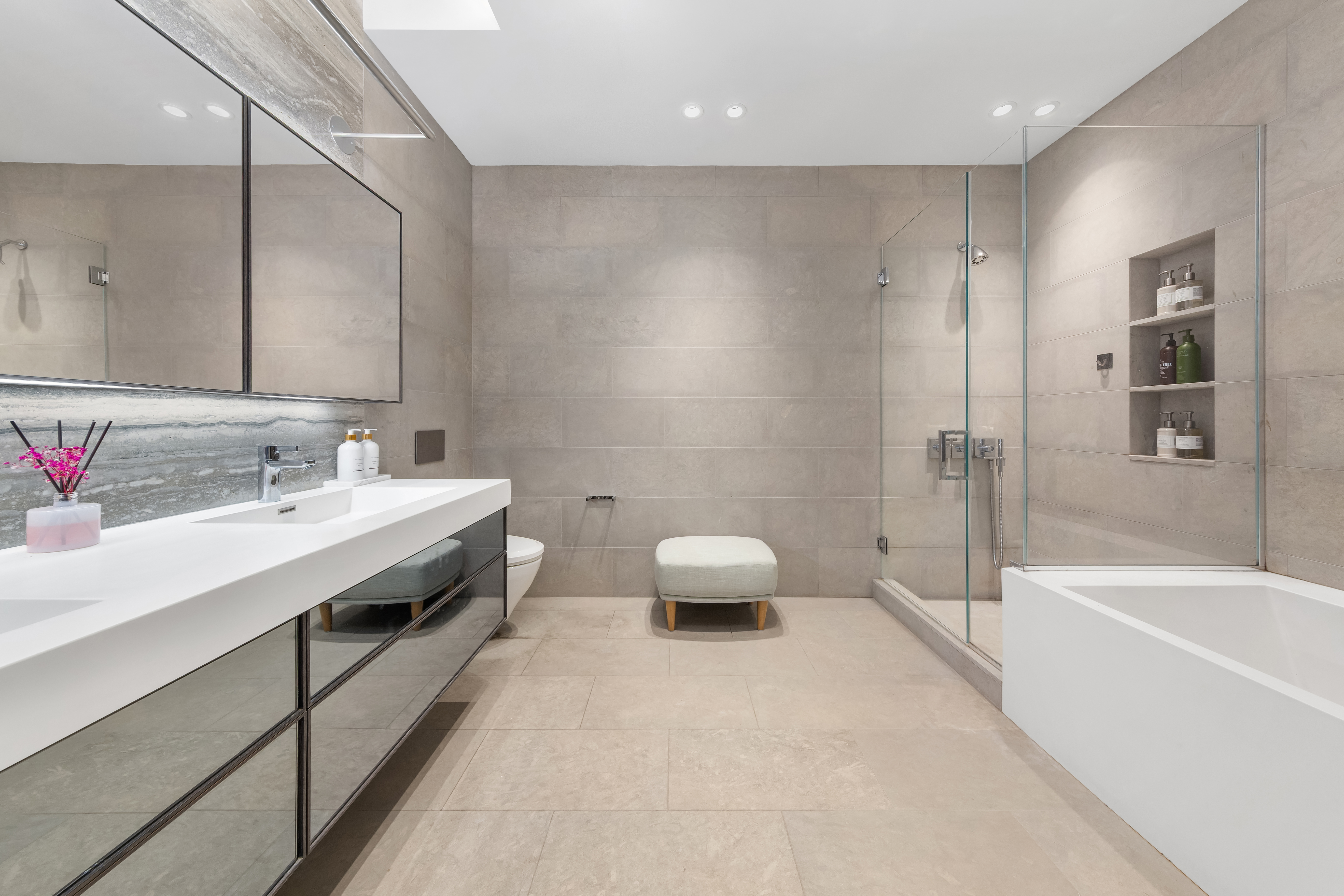 90 Lexington Avenue, Unit MC Manhattan, NY 10016 - Photo 8 of 26 a bathroom with a double vanity sink toilet and bathtub