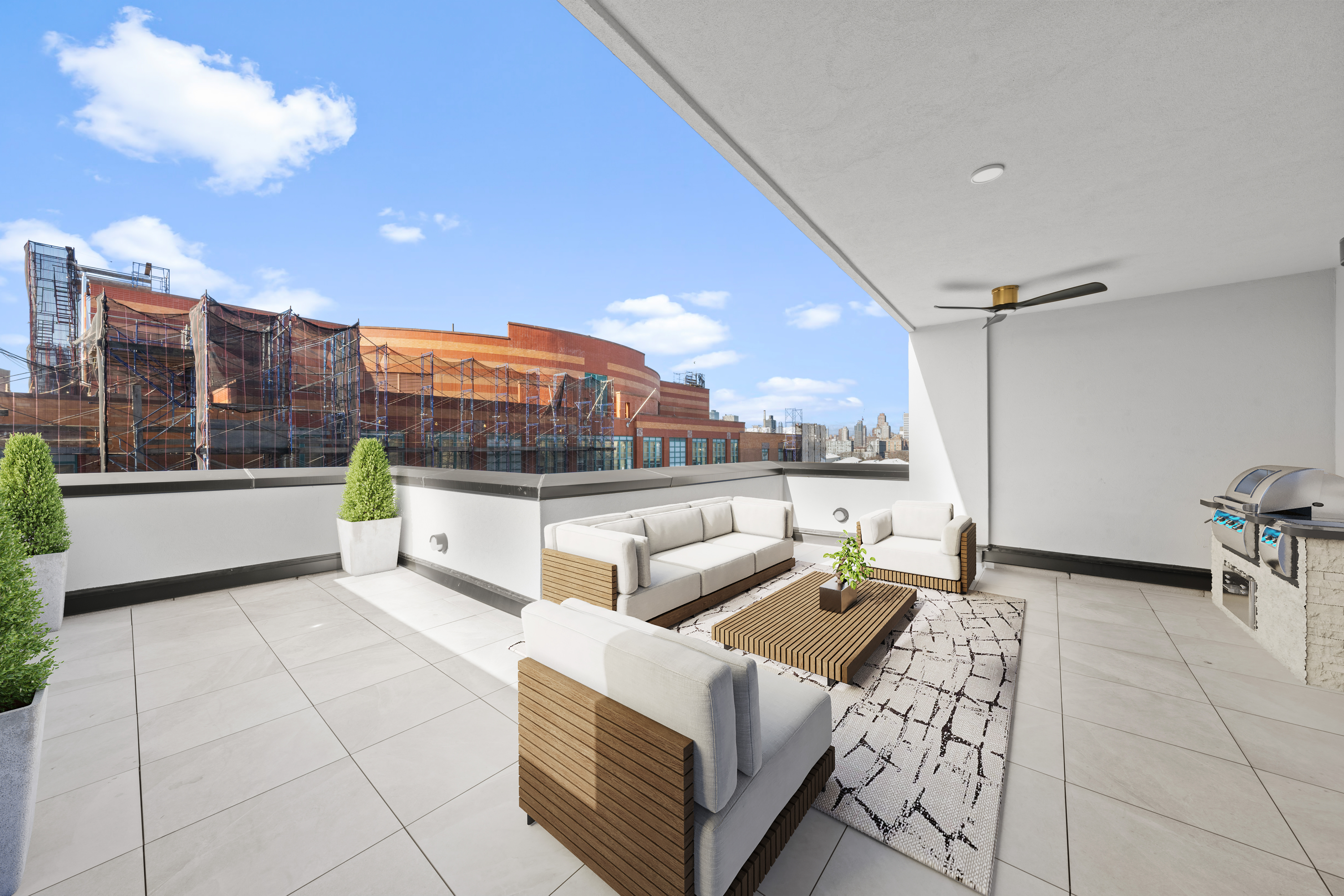 14-35 Broadway, Unit PH Queens, NY 11106 - Photo 21 of 24 a living room with furniture and a view of kitchen