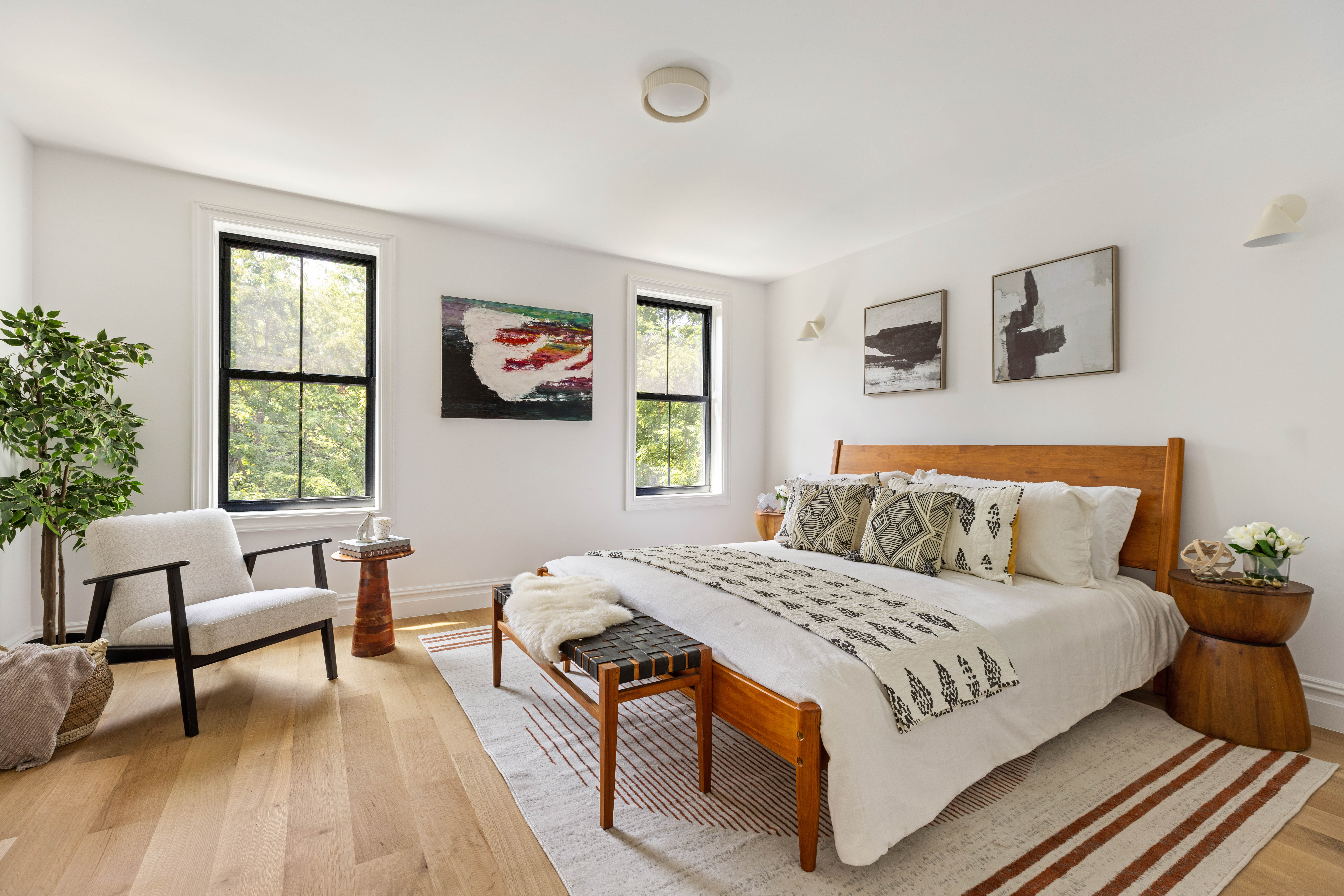 174 Hall Street Brooklyn, NY 11205 - Photo 6 of 14 a bedroom with a large bed and a couch