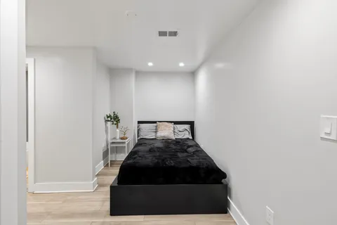 a bedroom with a bed and a walk in closet