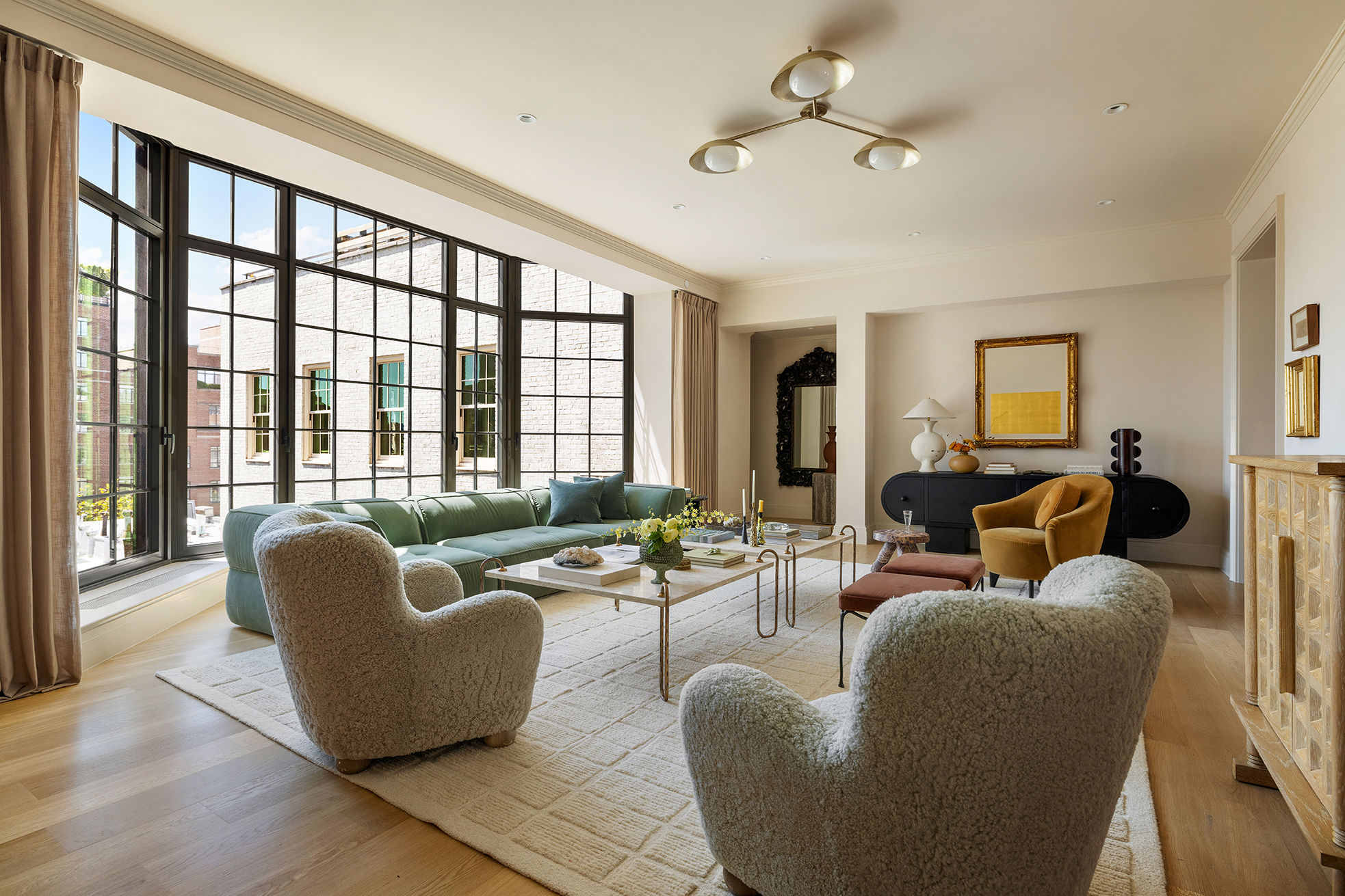 118 West 13th Street, Unit PH Manhattan, NY 10011 - Photo 3 of 31 a living room with furniture and a large window
