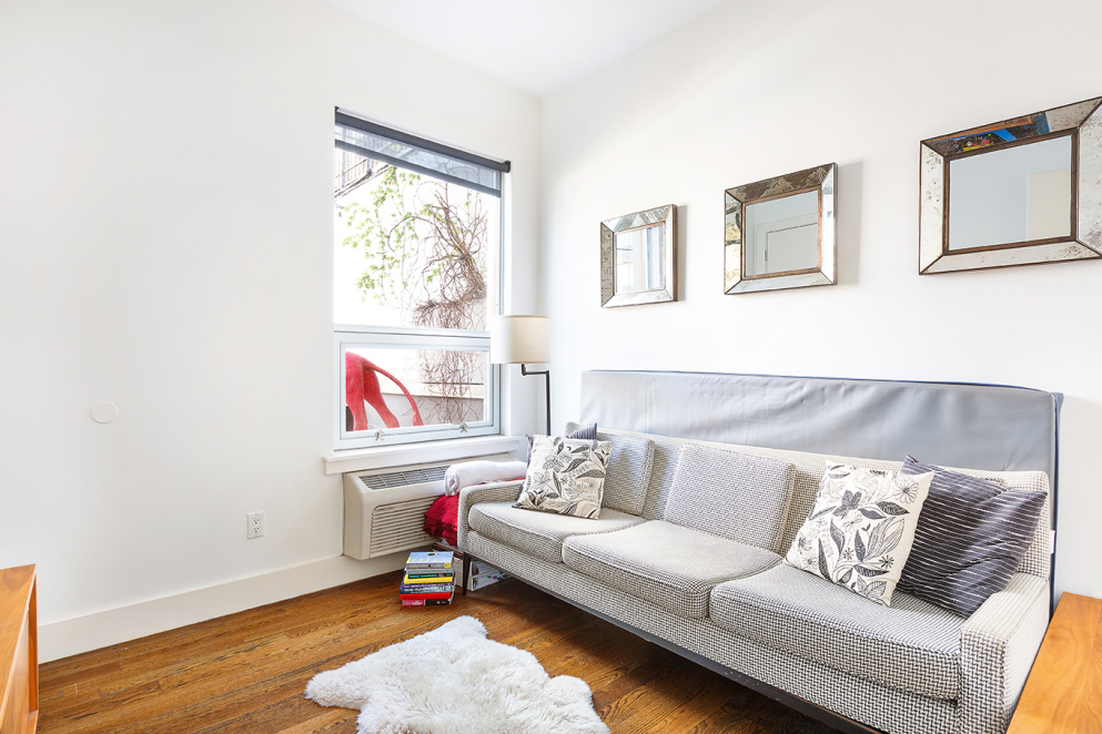 15 Roebling Street, Unit 2A Brooklyn, NY 11211 - Photo 6 of 8 a living room with furniture and a window