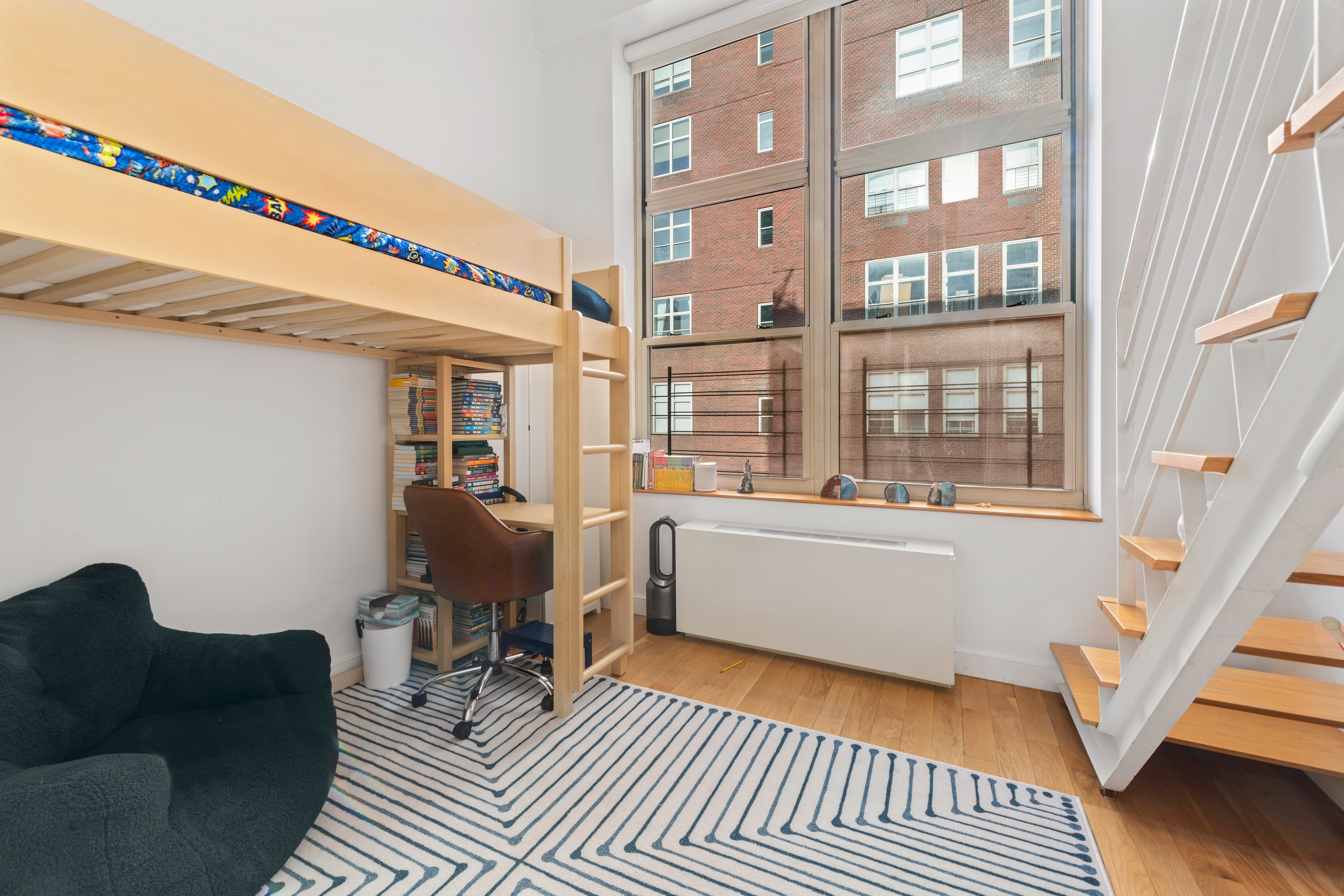 120 East 87th Street, Unit R16G Manhattan, NY 10128 - Photo 10 of 20 a living room with furniture and a window