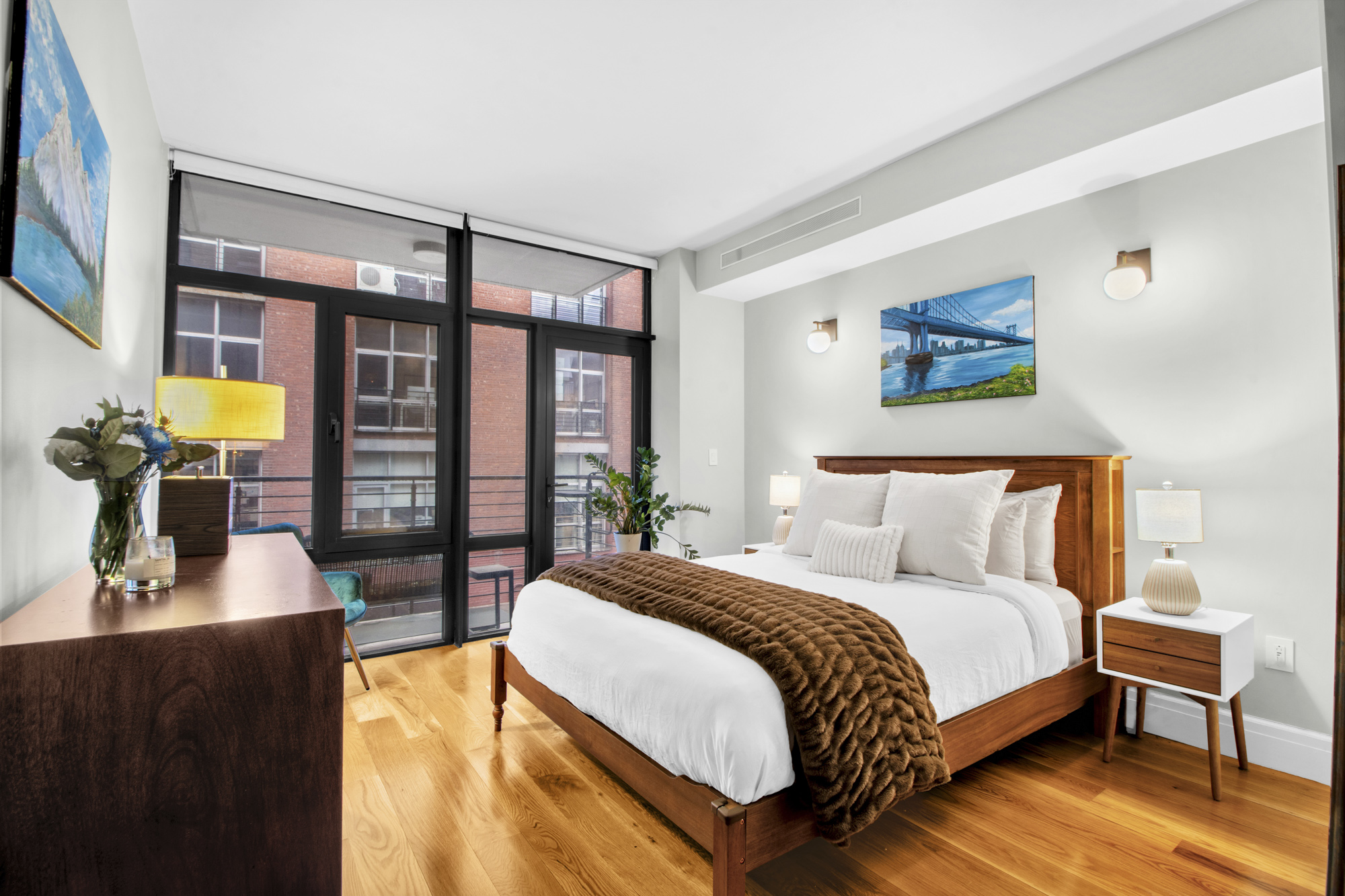 47 Bridge Street, Unit 3D Brooklyn, NY 11201 - Photo 9 of 27 a bedroom with a large bed and a flat tv screen