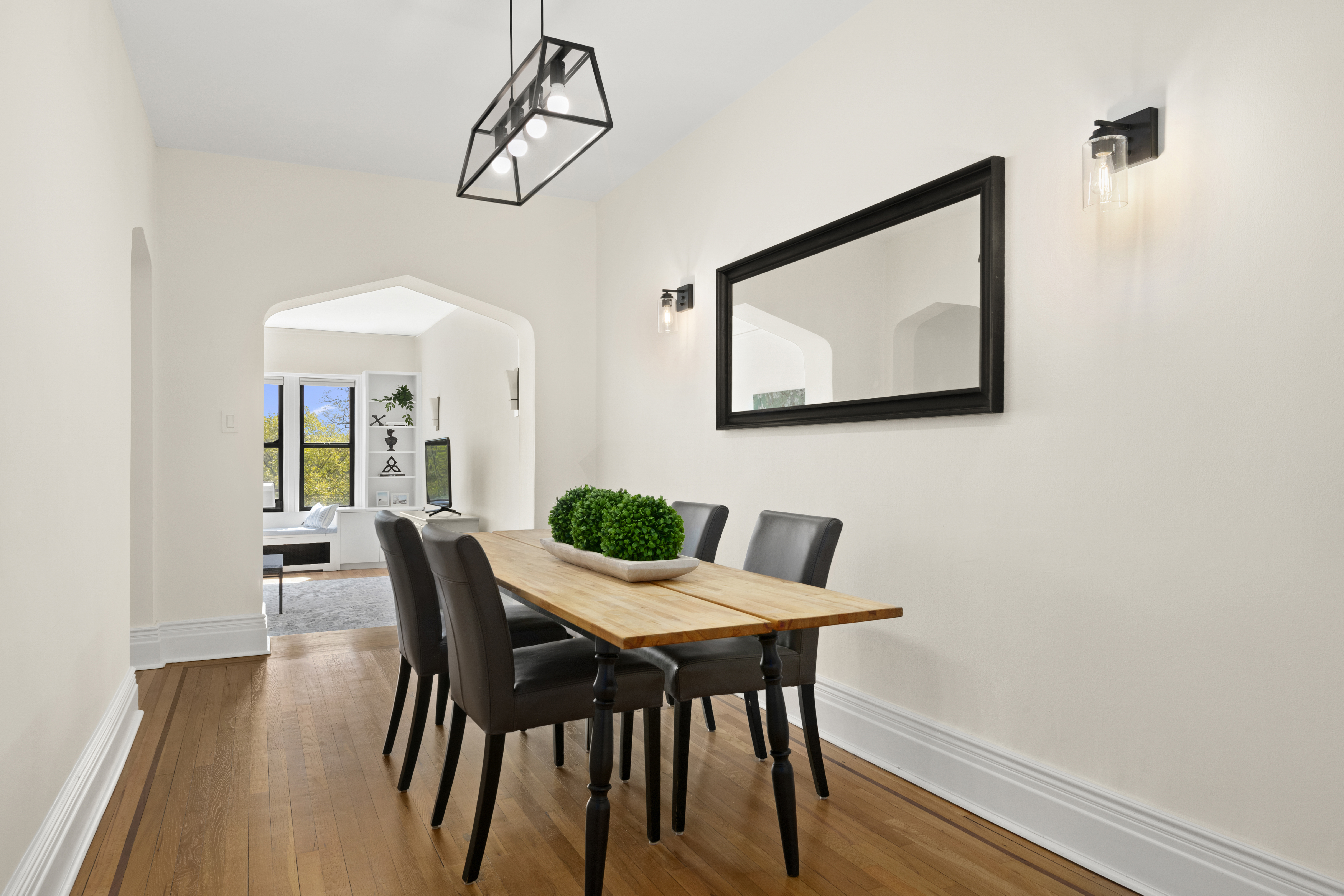 3875 Waldo Avenue, Unit 6E Bronx, NY 10463 - Photo 3 of 11 a view of a dining room with furniture and wooden floor
