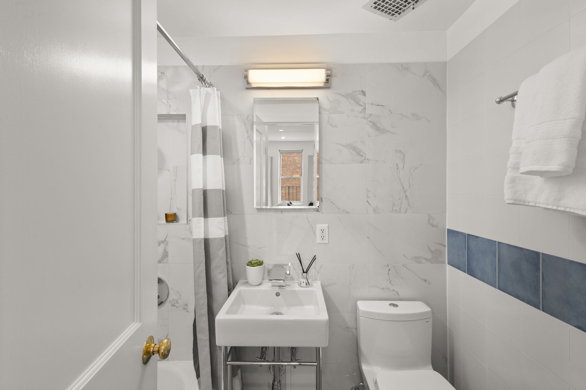 237 East 12th Street, Unit 2A Manhattan, NY 10003 - Photo 8 of 16 a bathroom with a sink toilet and shower
