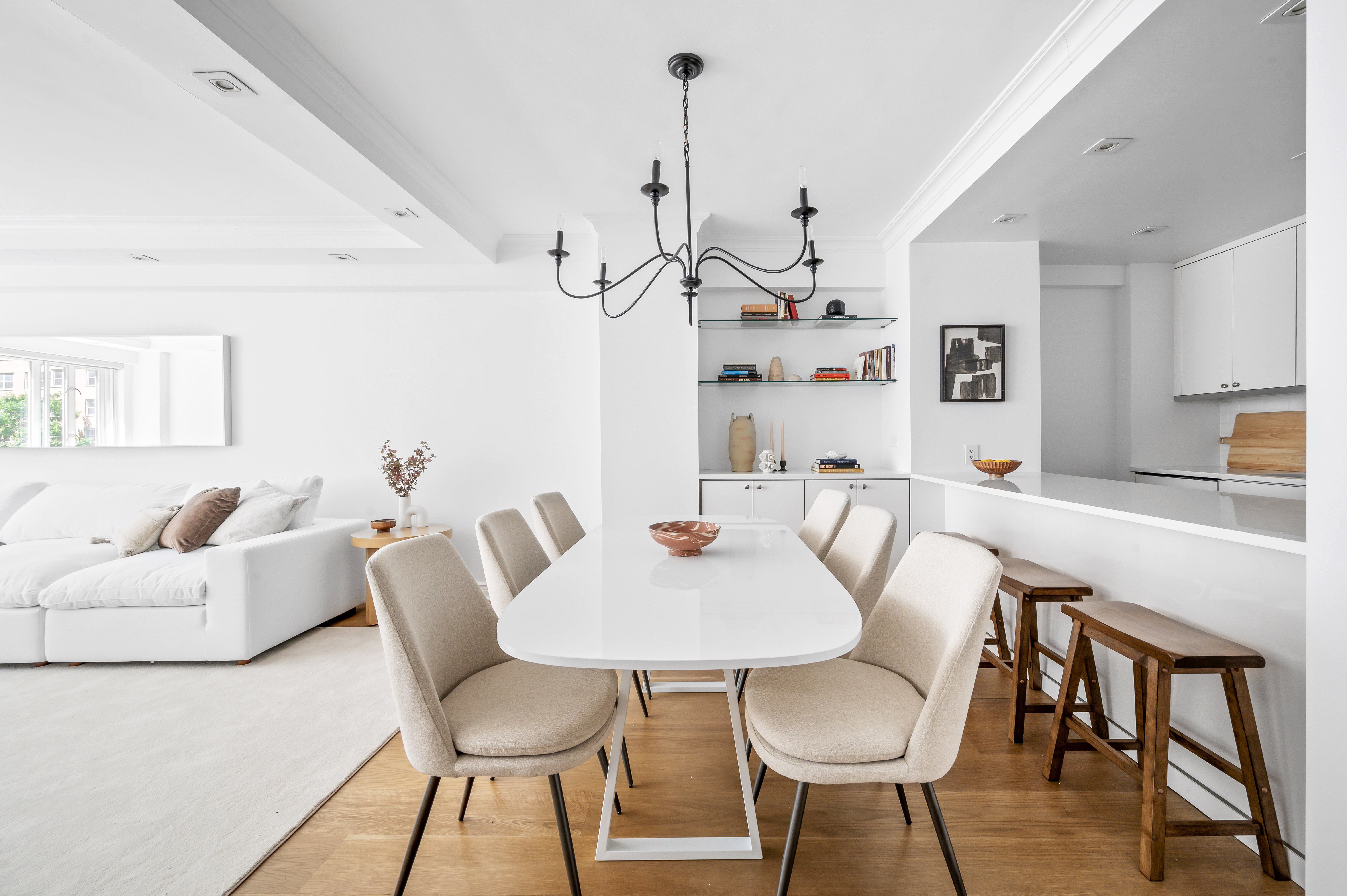 166 East 63rd Street, Unit 2J Manhattan, NY 10065 - Photo 4 of 14 a view of a dining room with furniture and wooden floor