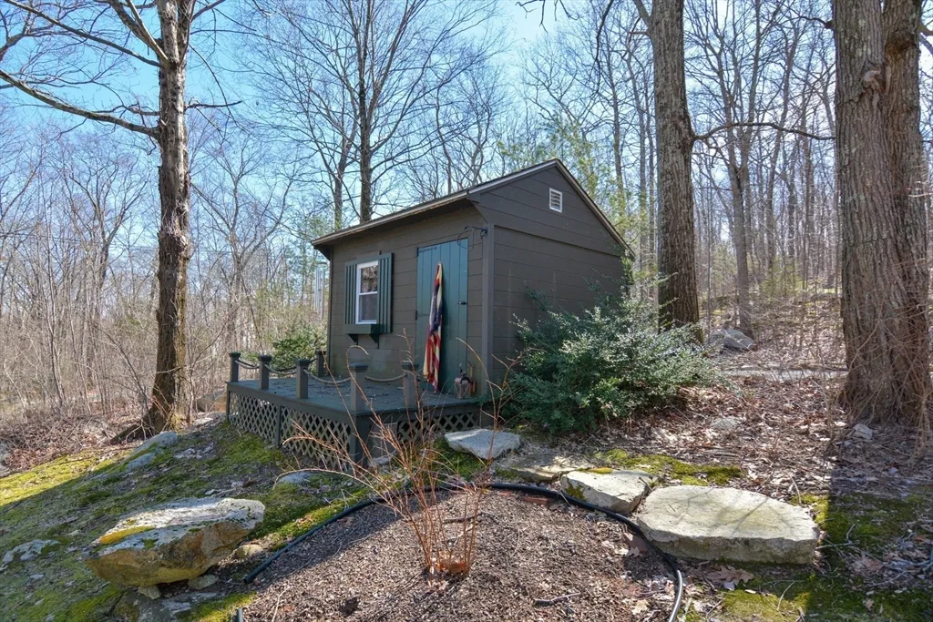 a backyard of a house with yard and outdoor seating