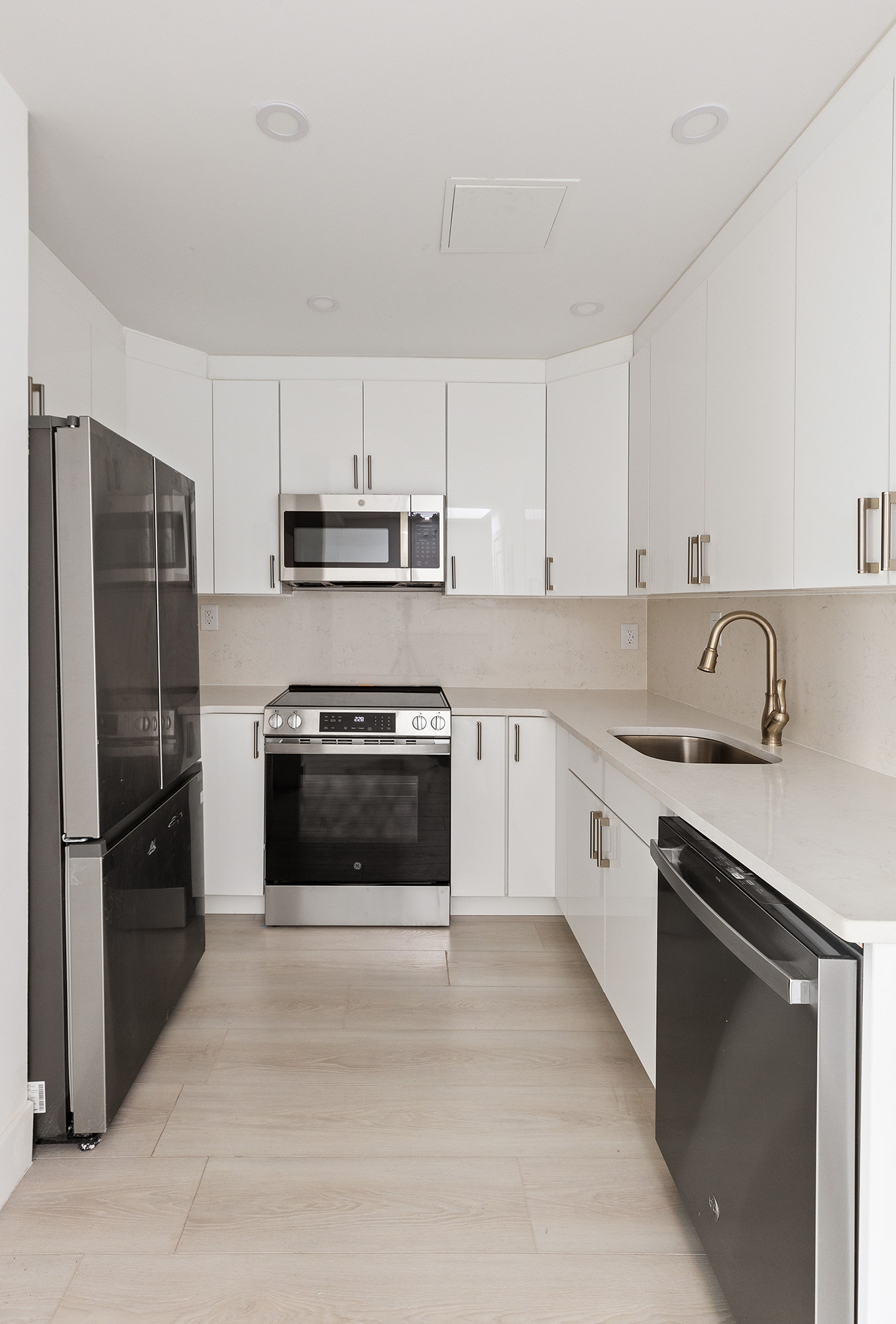 392 5th Avenue, Unit 3A Brooklyn, NY 11215 - Photo 4 of 9 a kitchen with granite countertop a refrigerator stove and sink