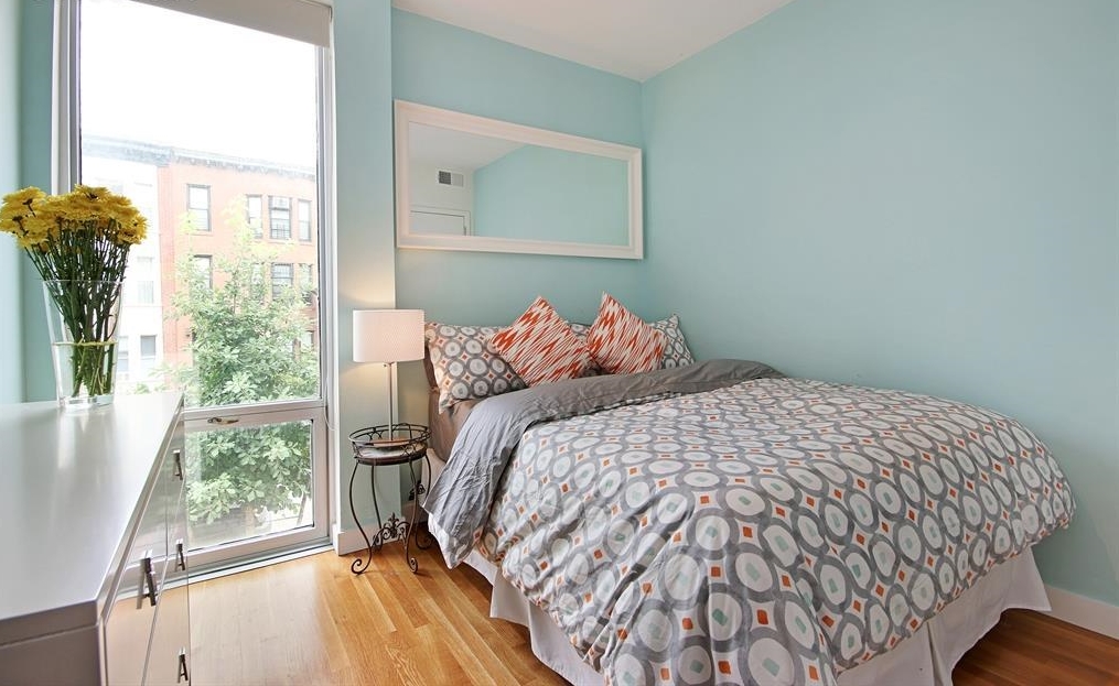 232 7th Street, Unit 2A Brooklyn, NY 11215 - Photo 3 of 8 a bedroom with a bed and a window