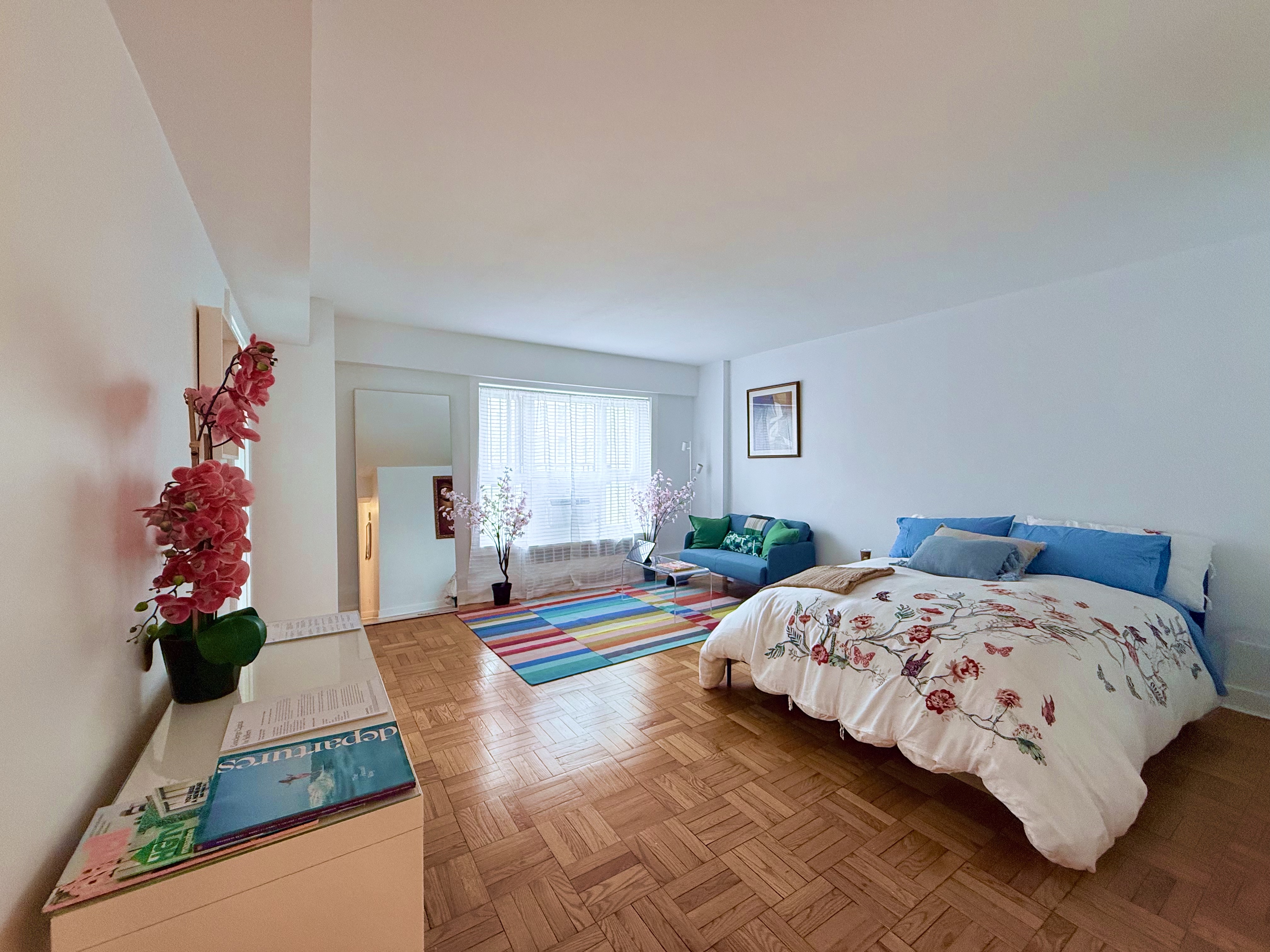 a bedroom with bed and window